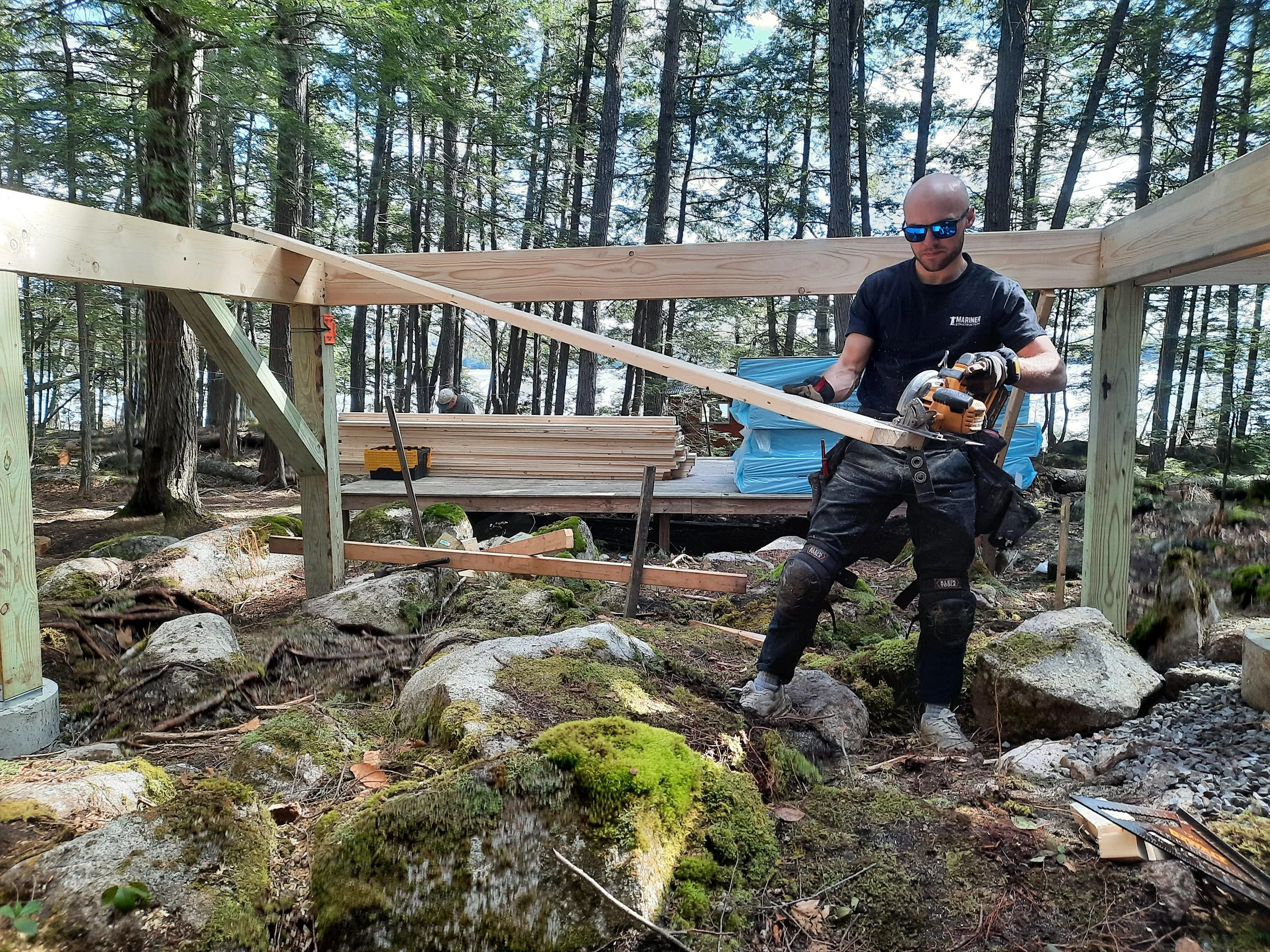 Kyle a lead carpenter building a camp on Hoyt Island on Great Pond in Belgrade Maine