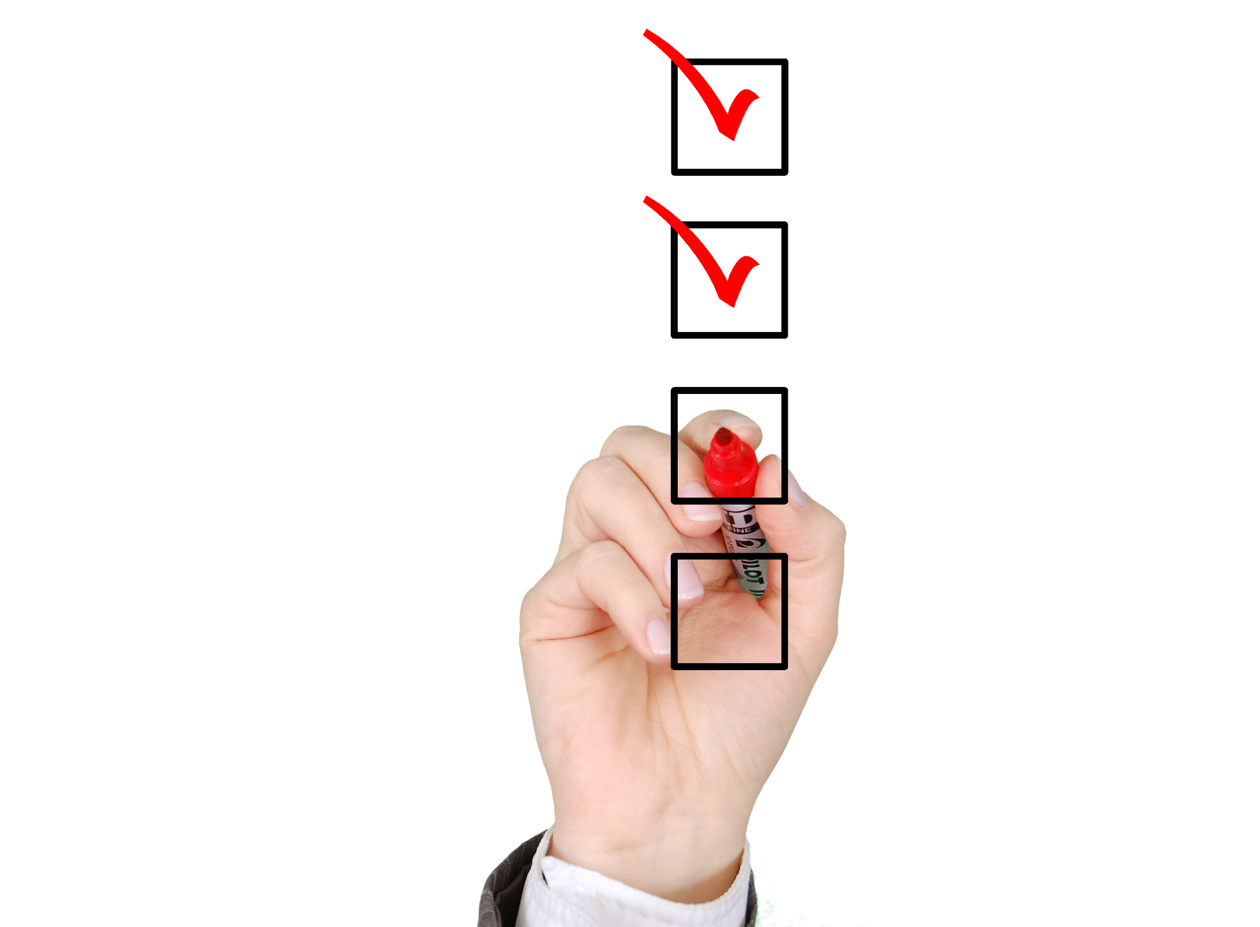 Hand checking boxes with a red marker