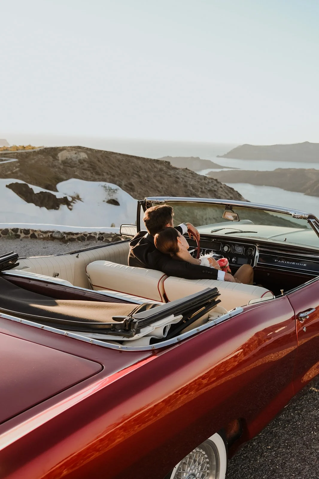wedding in santorini couple in a vintage car