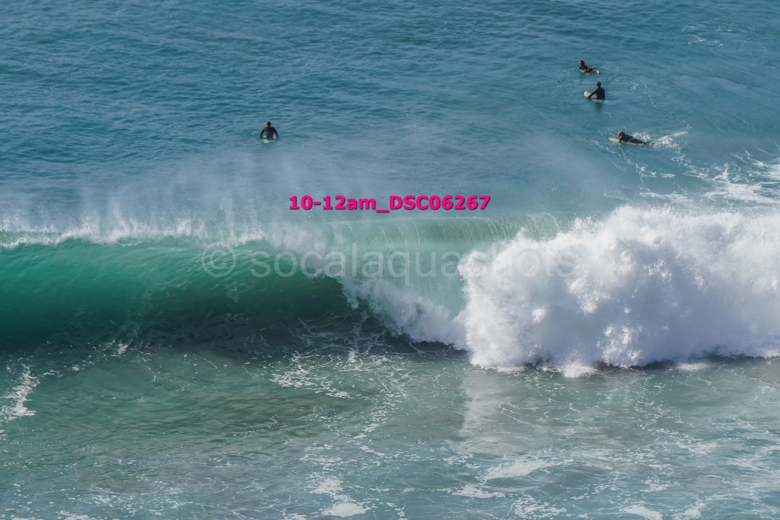 People surfing on an ocean wave
