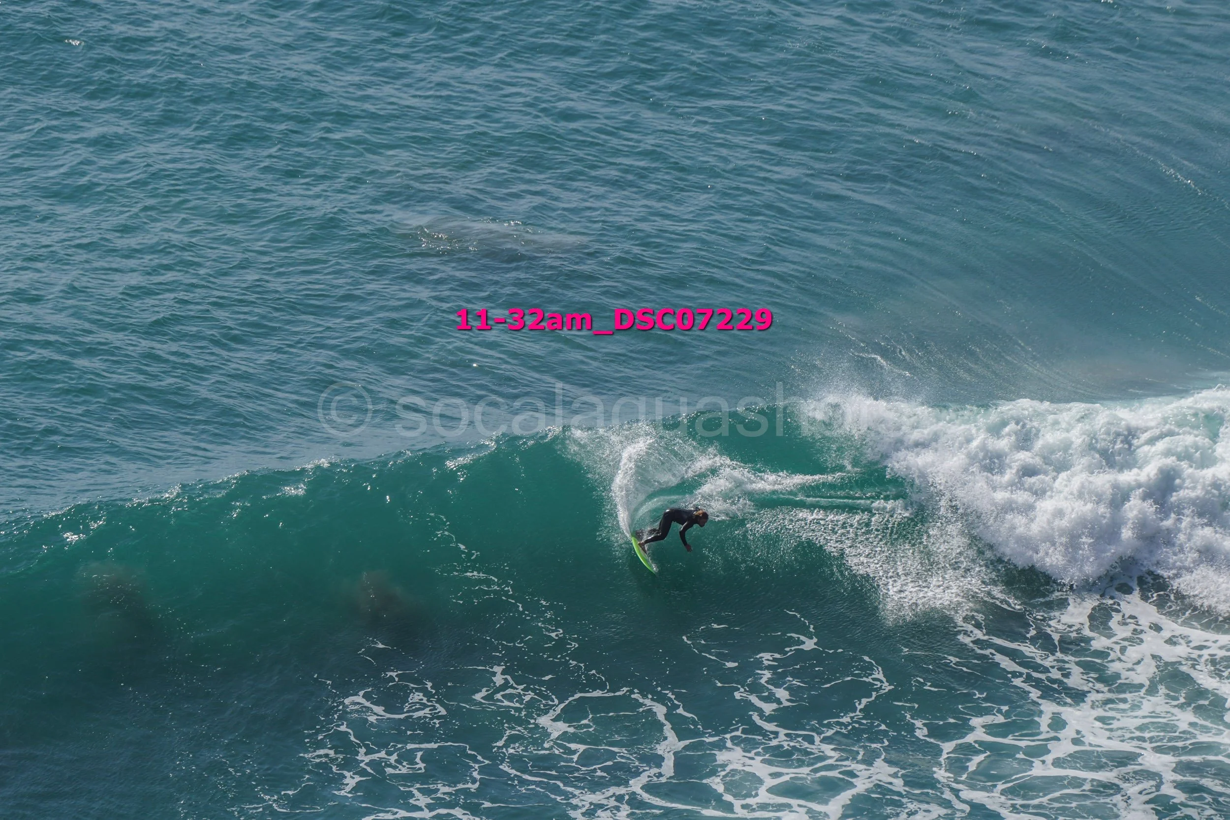 A person surfing on a wave in the ocean.