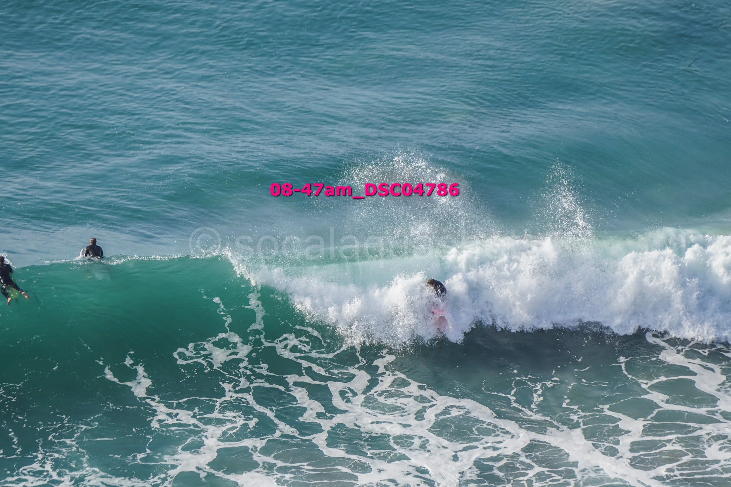 People surfing on the ocean waves during daytime.