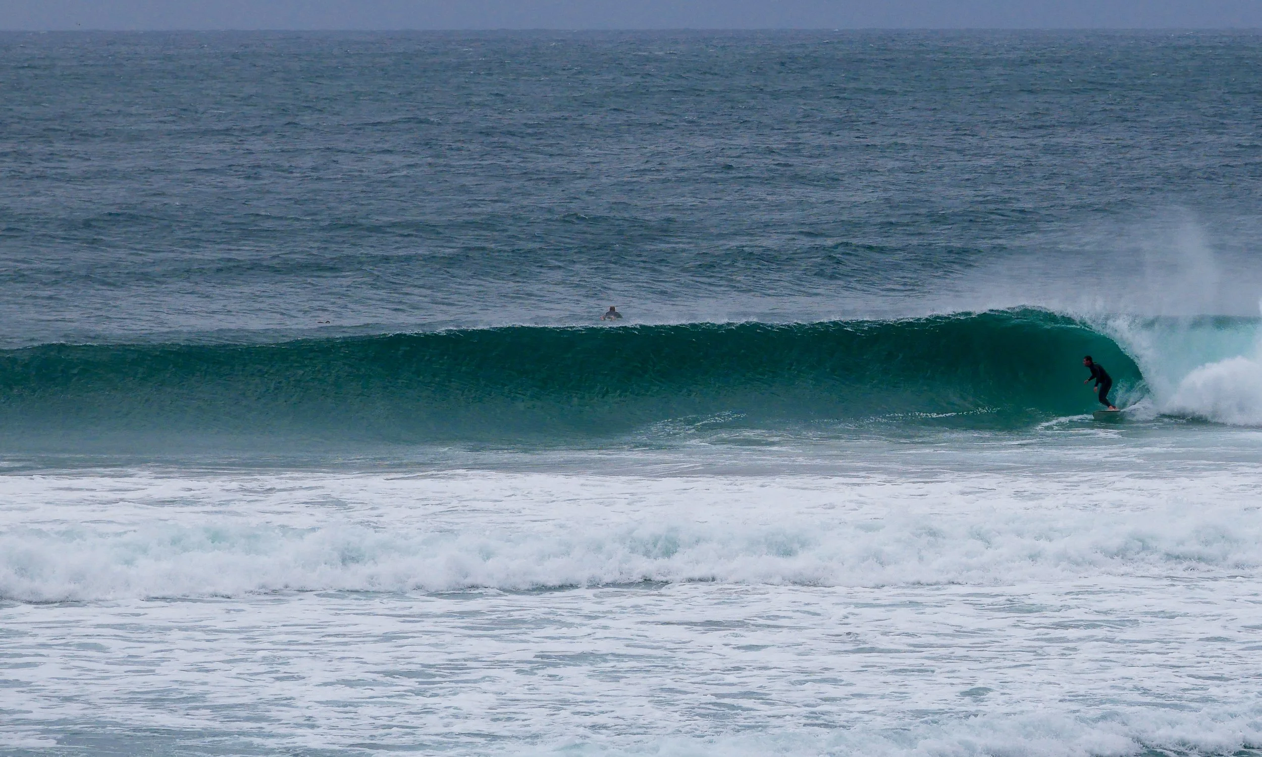 Surfer riding a wave in the ocean
