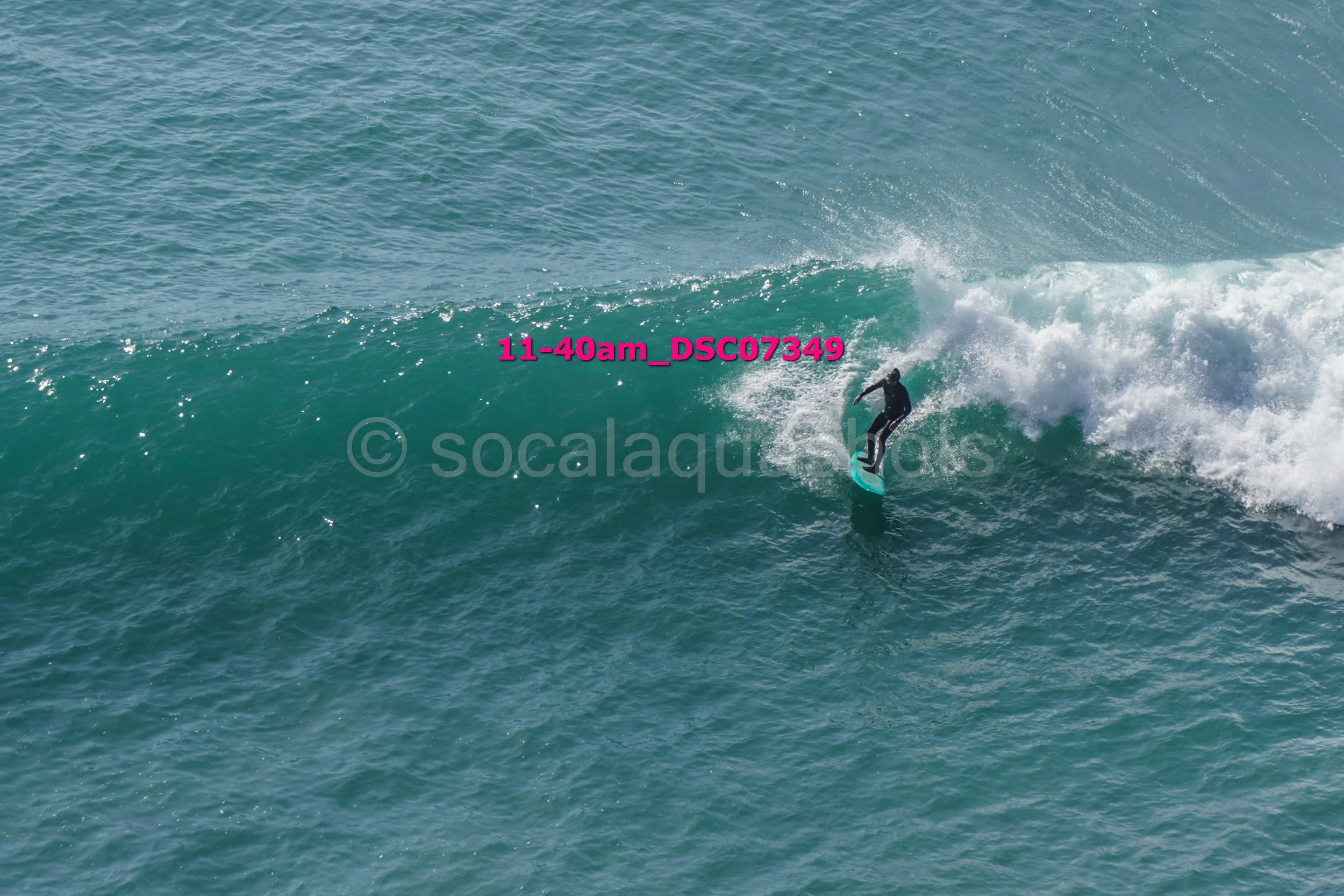 A person surfing on a wave in the ocean.