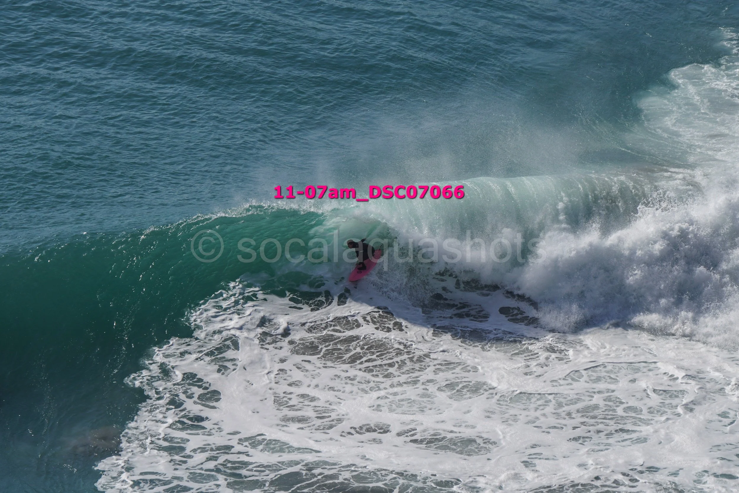 Surfer riding a wave in the ocean.