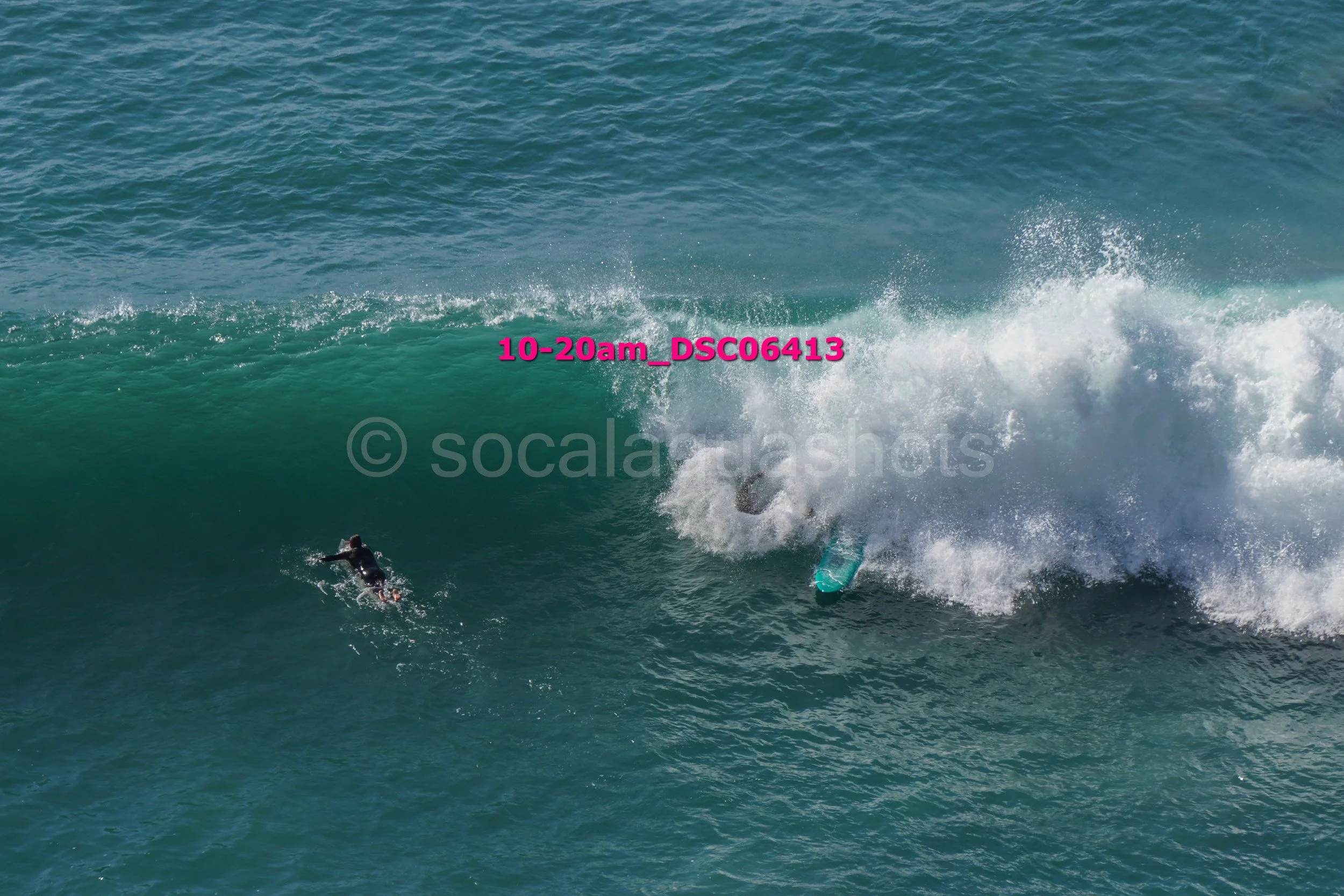 Surfer falling off a wave in the ocean