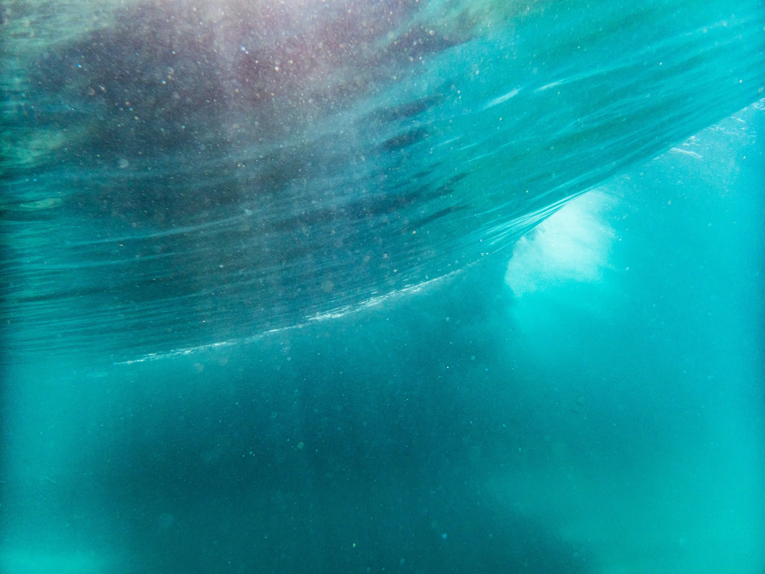Underwater view of a large wave.