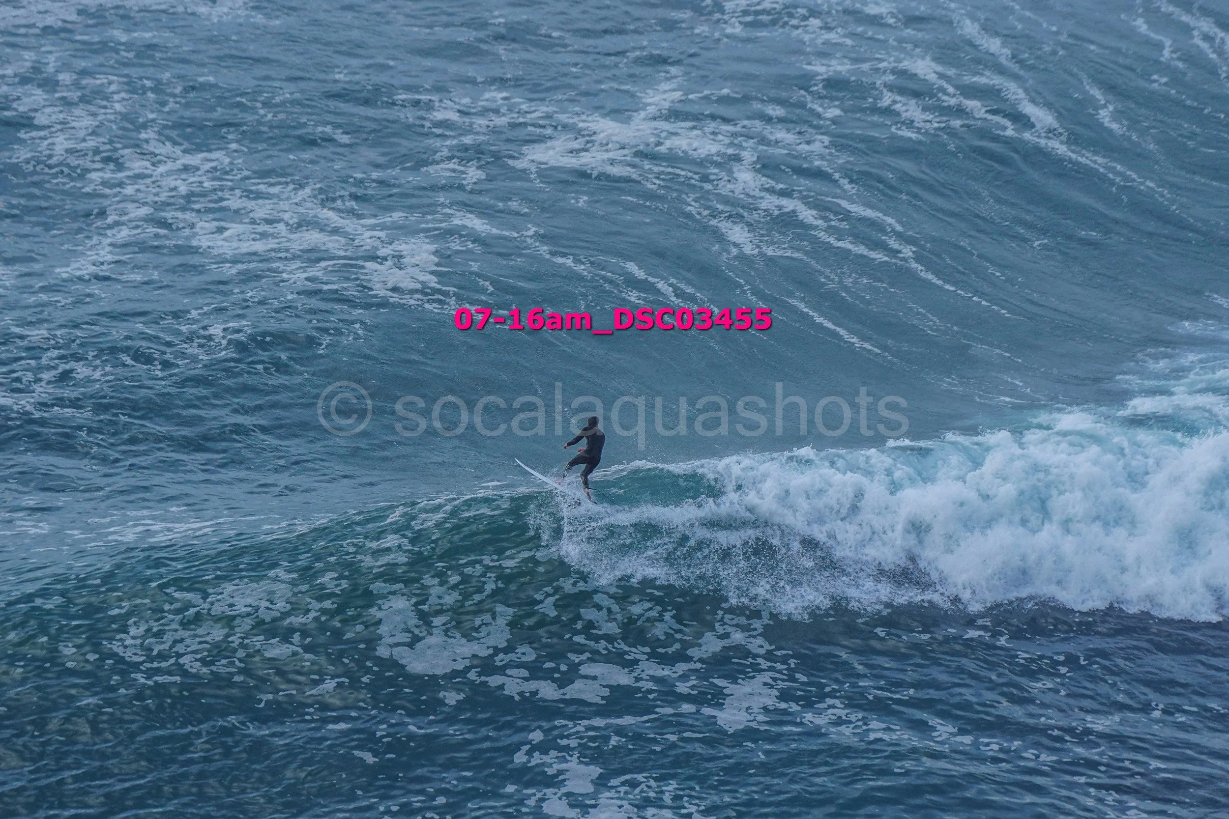 Surfer riding a wave in the ocean