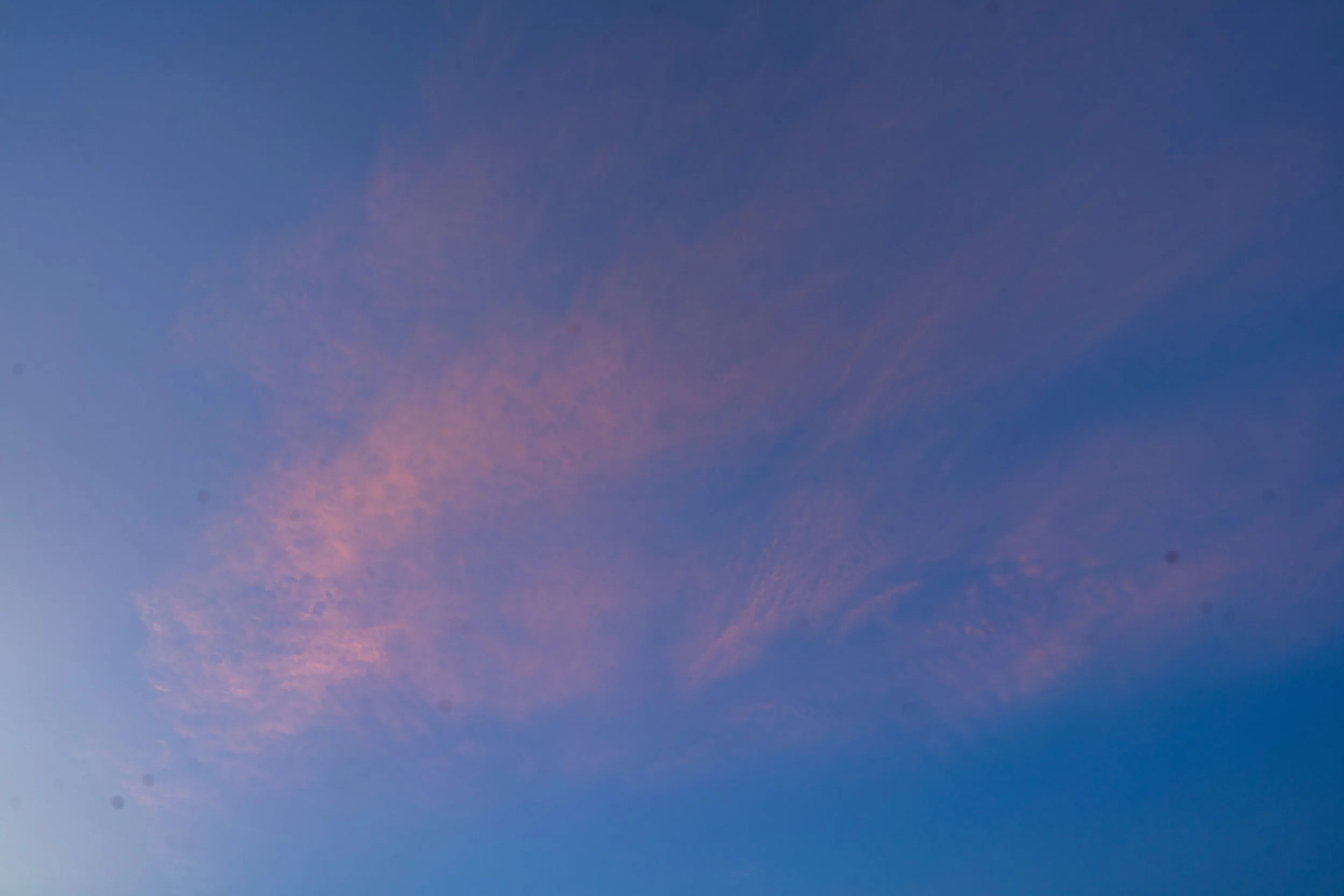 Sky with blue and pink clouds at dusk