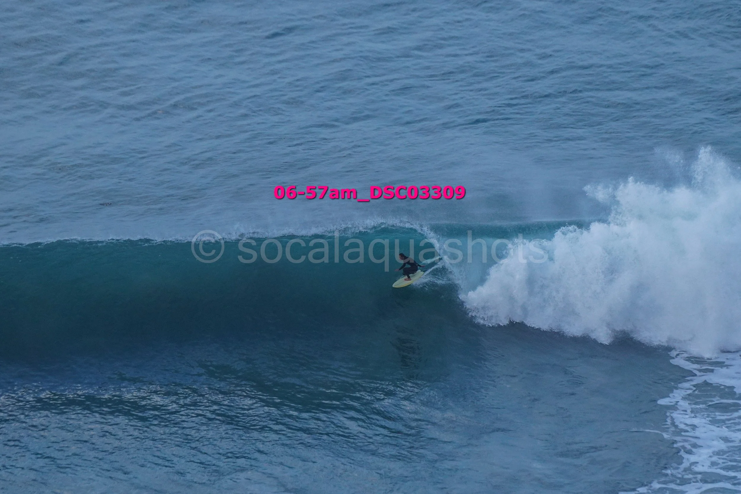 A surfer riding a large wave in the ocean