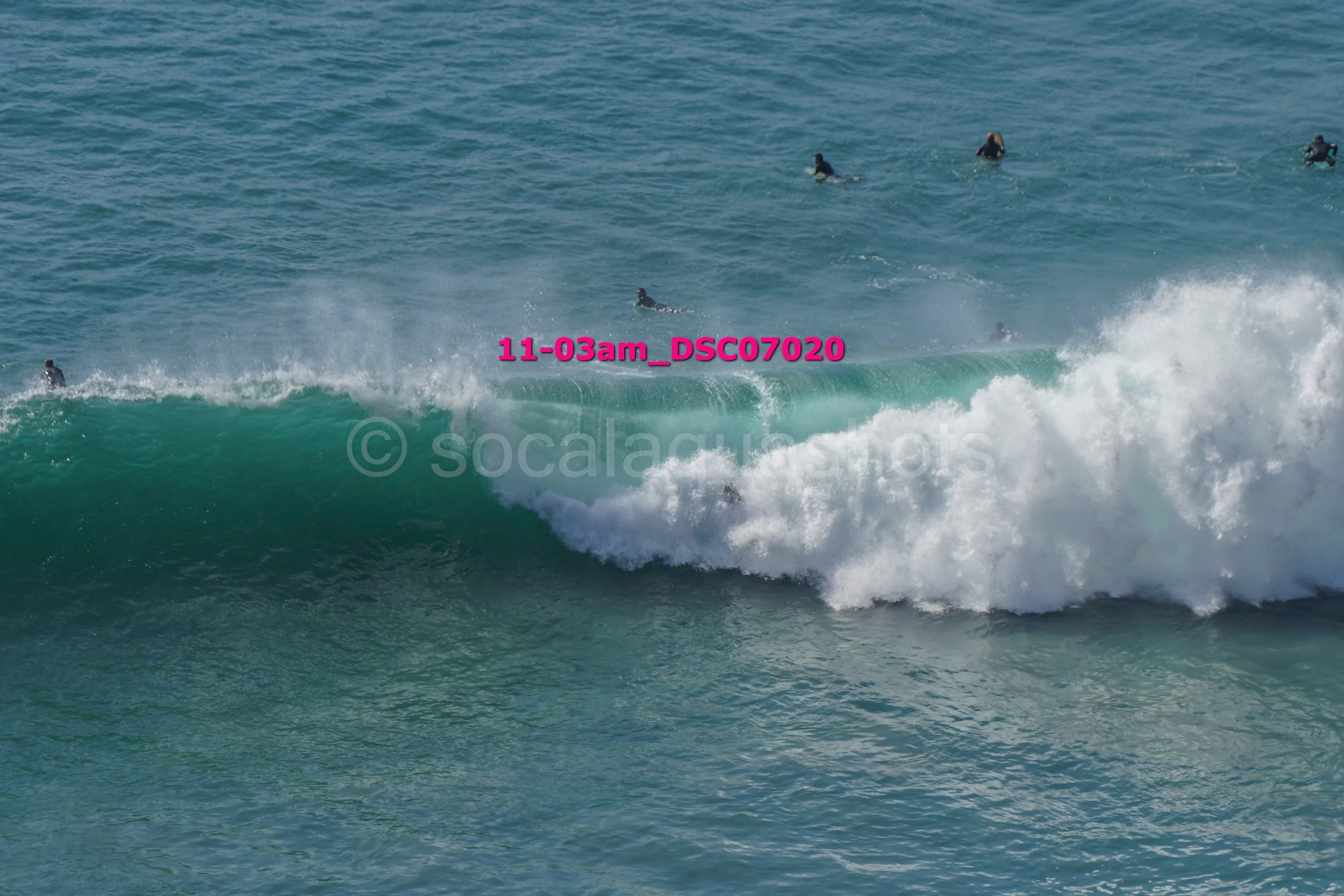 People surfing on the ocean waves.