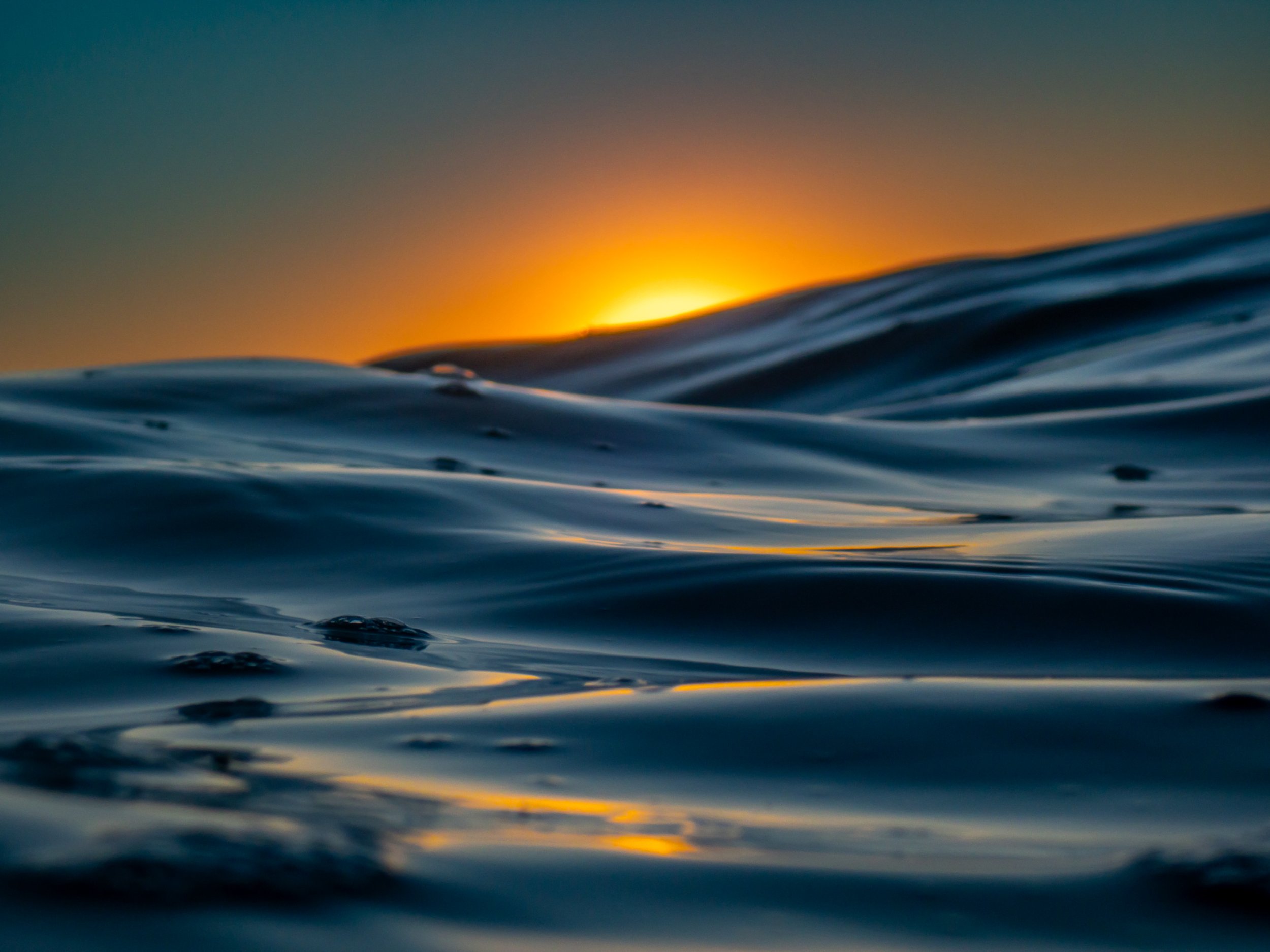 Close-up of ocean waves at sunset