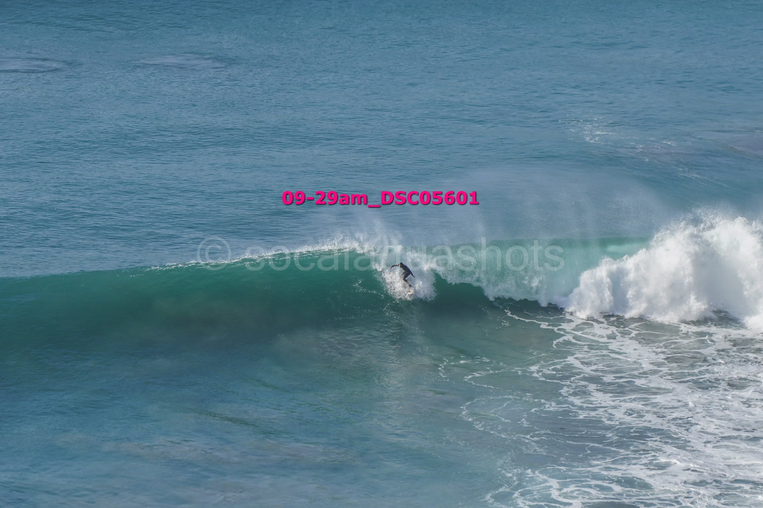 A person surfing on a wave in the ocean