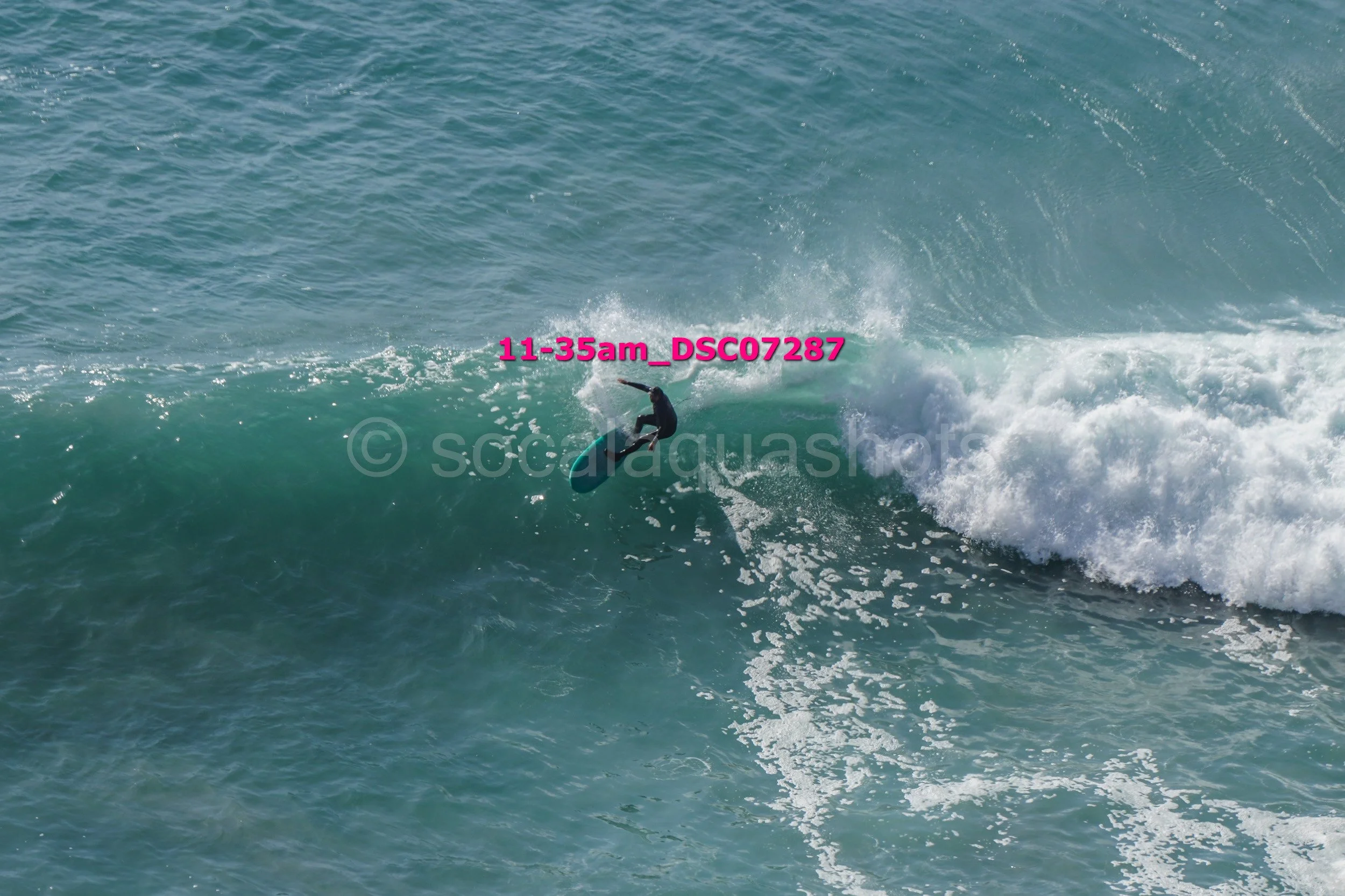 A person surfing on a wave in the ocean