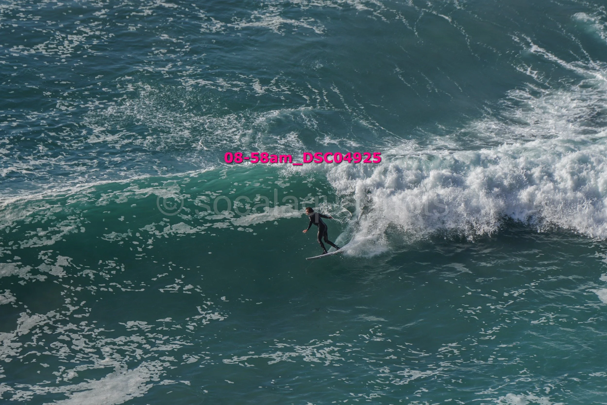 A person surfing on a wave in the ocean