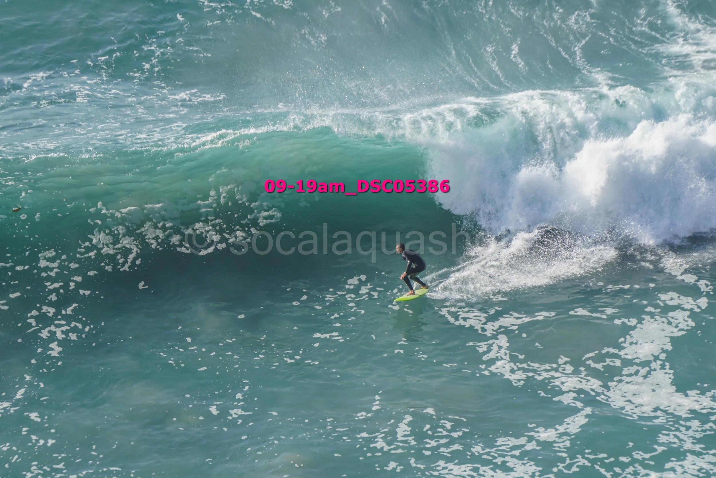 A person surfing on a wave in the ocean.