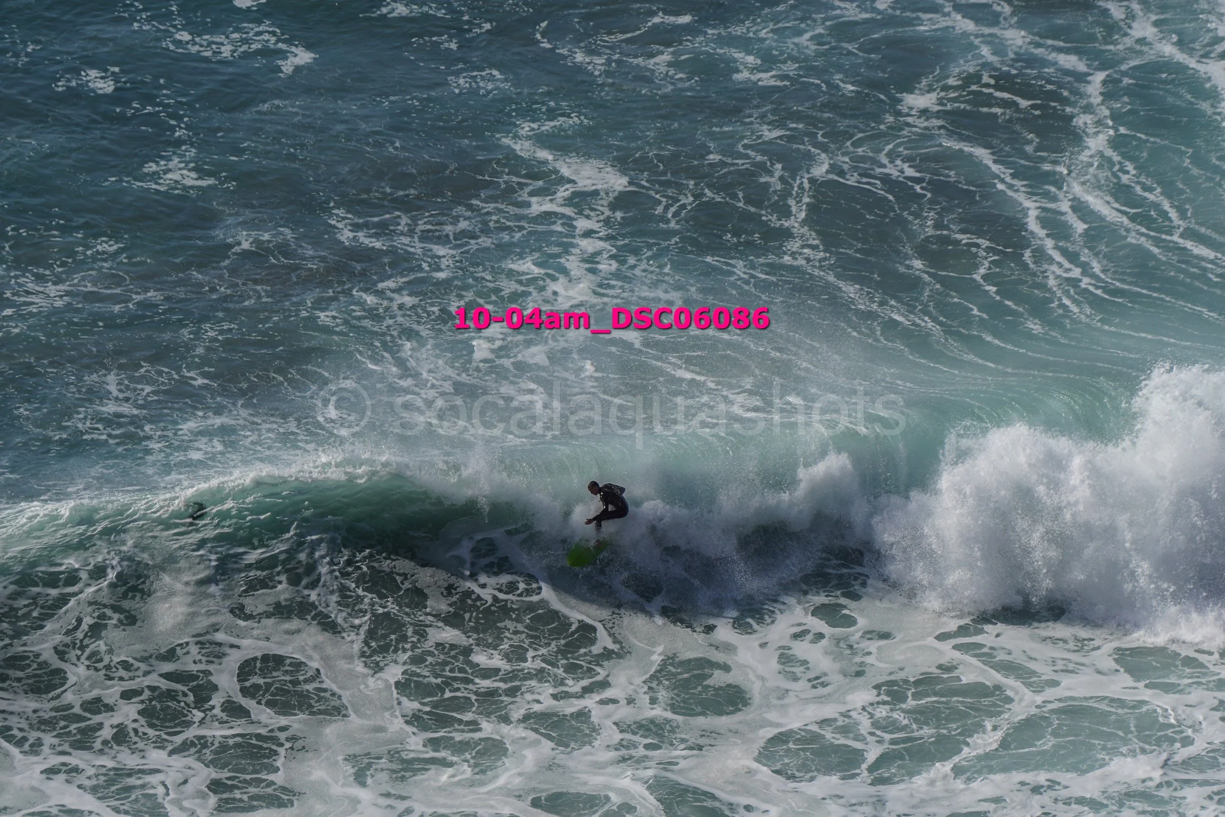 Surfer riding a wave in the ocean