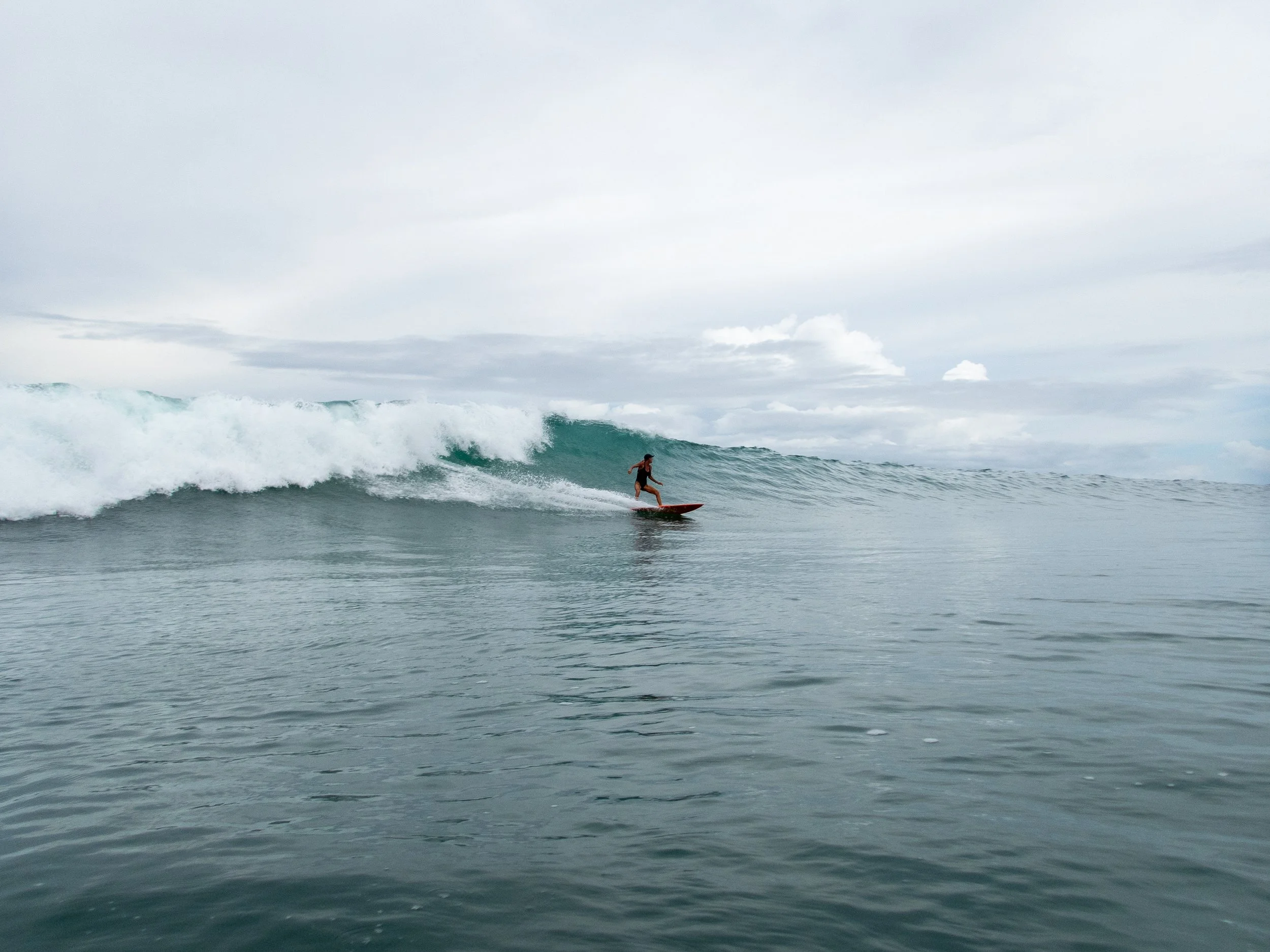 surfer riding a large wave in the ocean