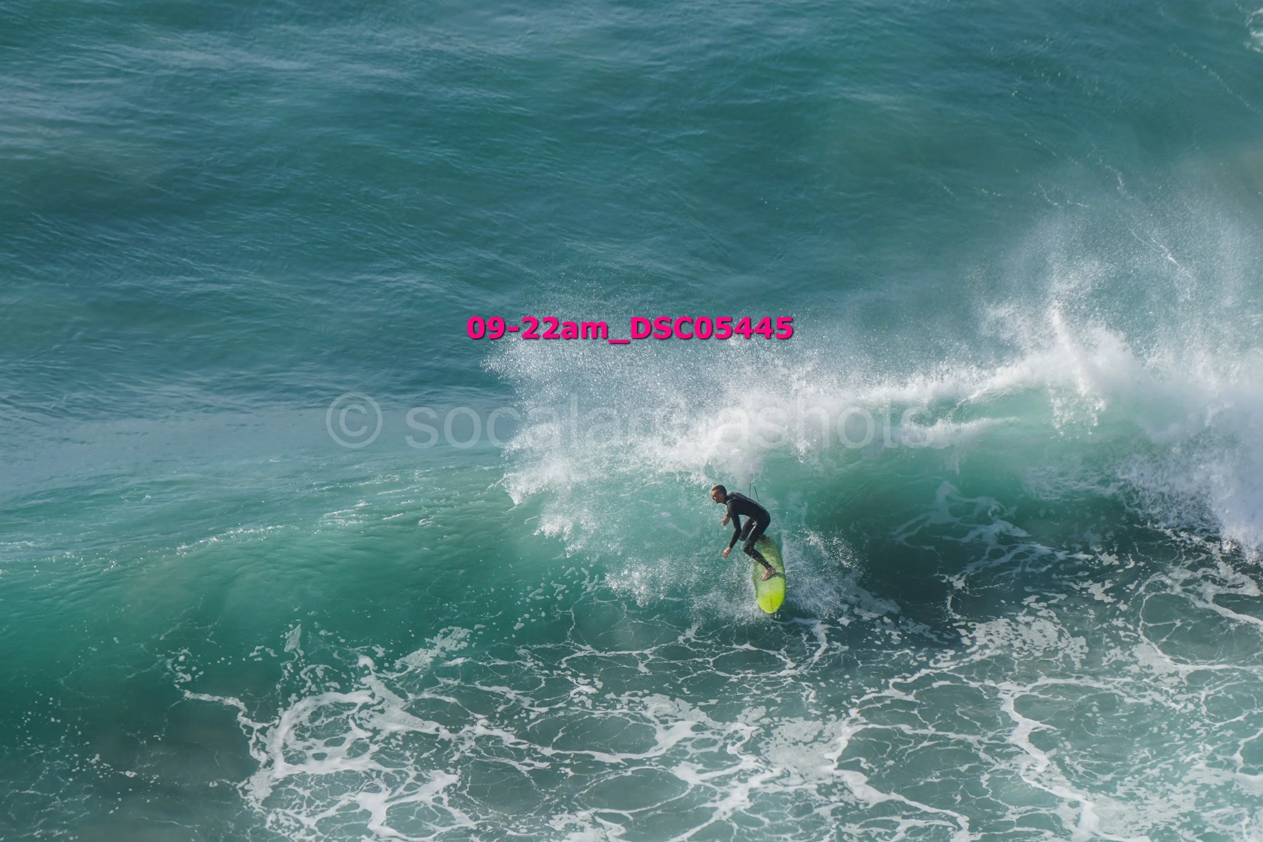A person surfing on a wave in the ocean
