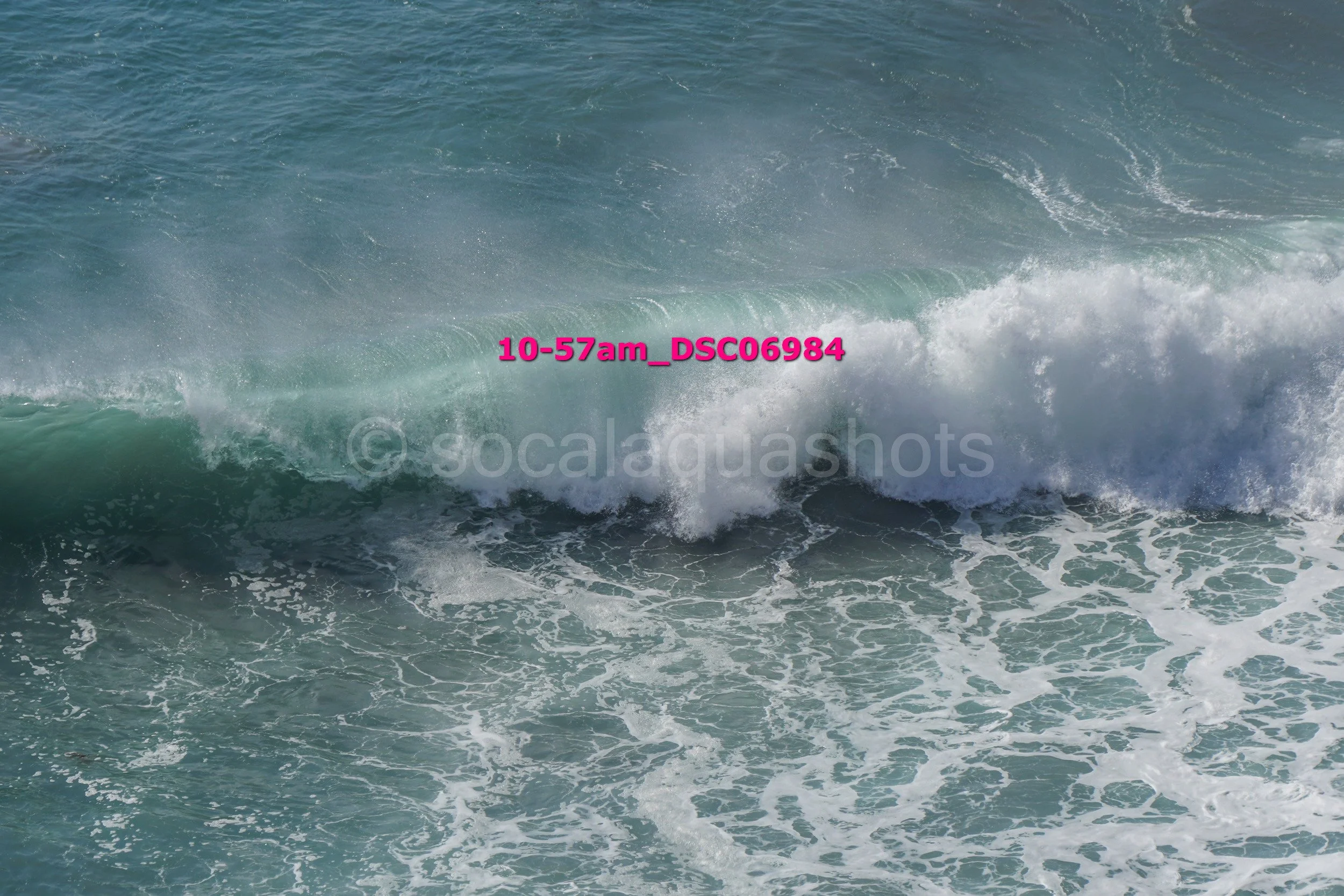 Ocean waves crashing with foamy white surf