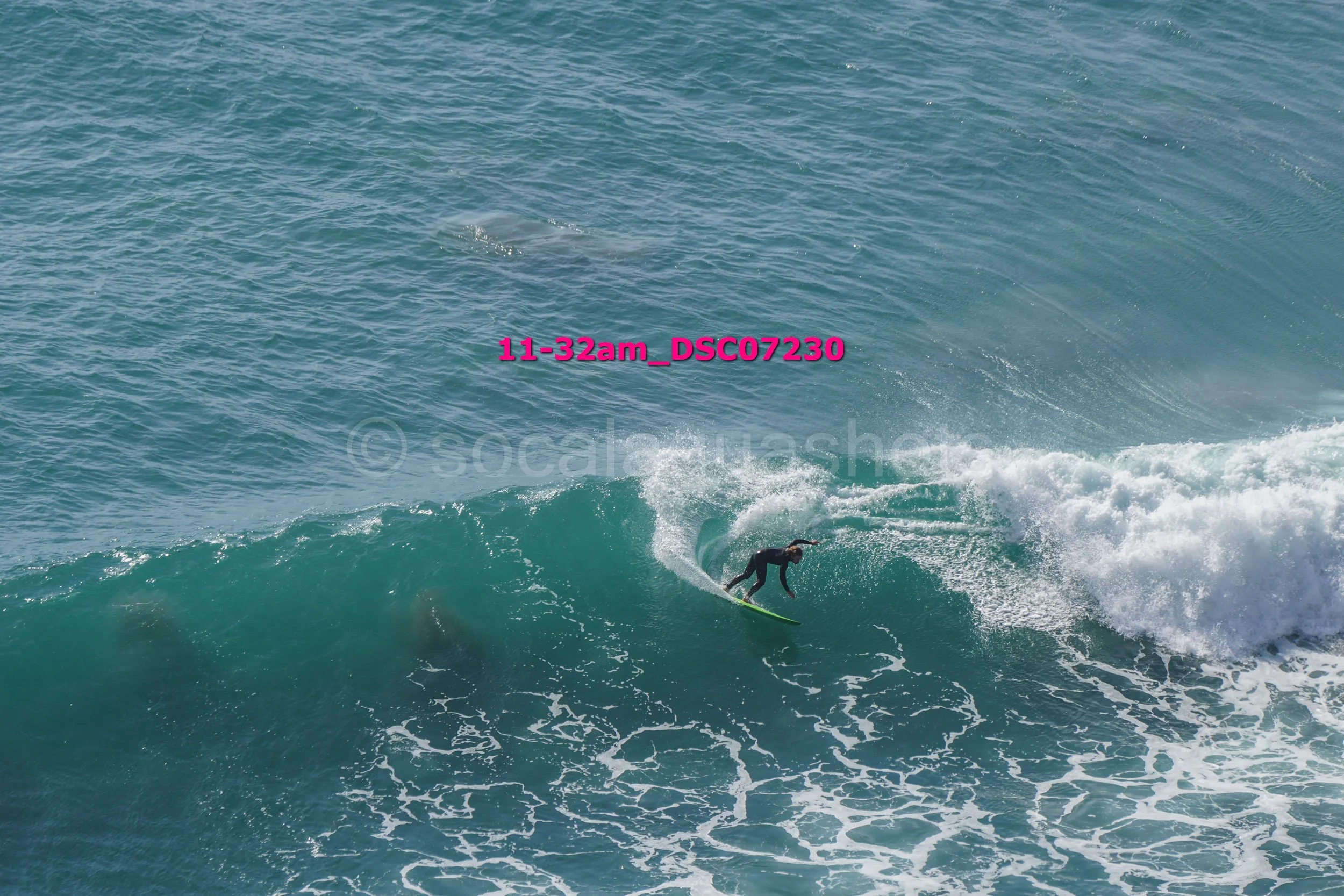 A person surfing on a wave in the ocean.