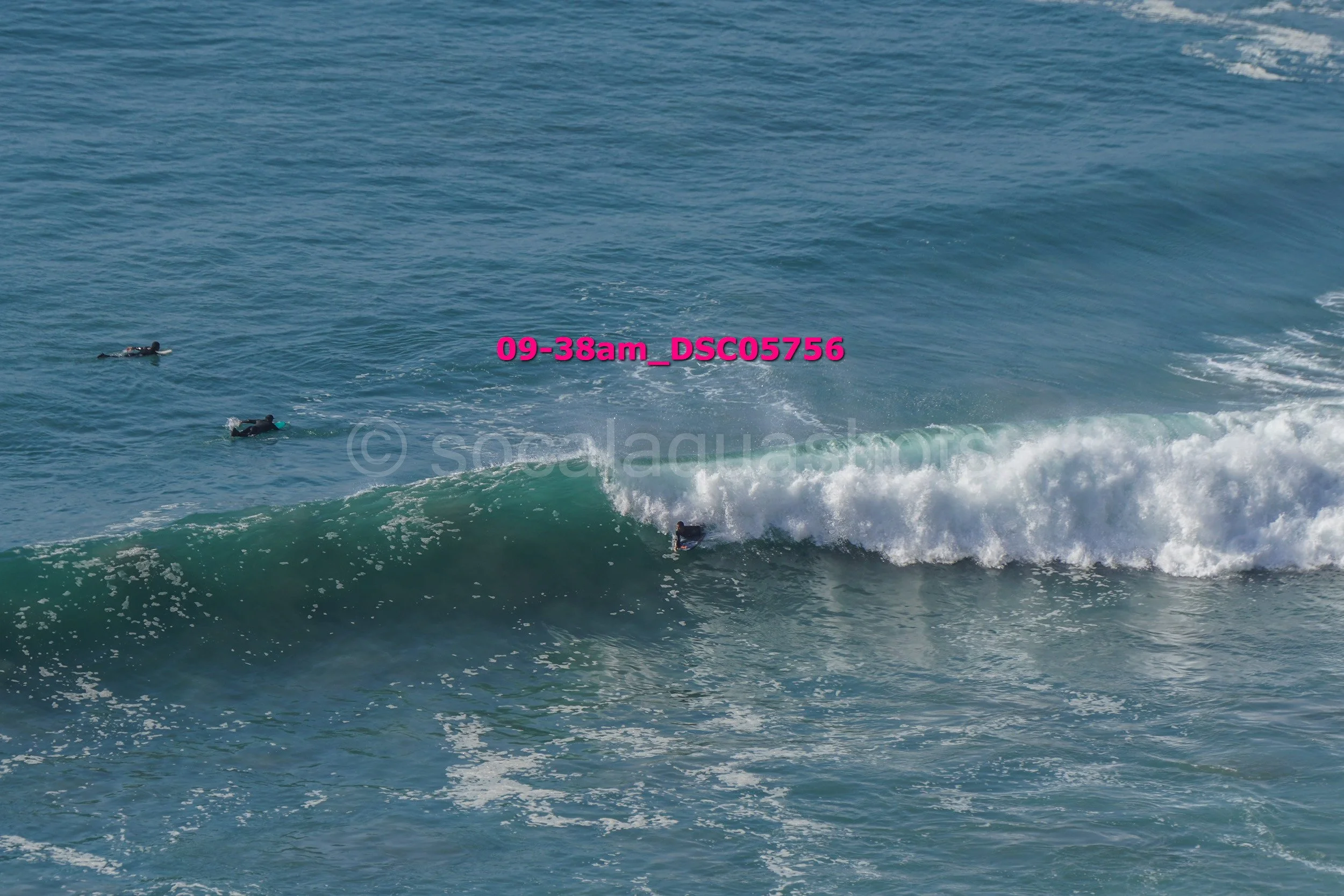 People surfing on ocean waves.