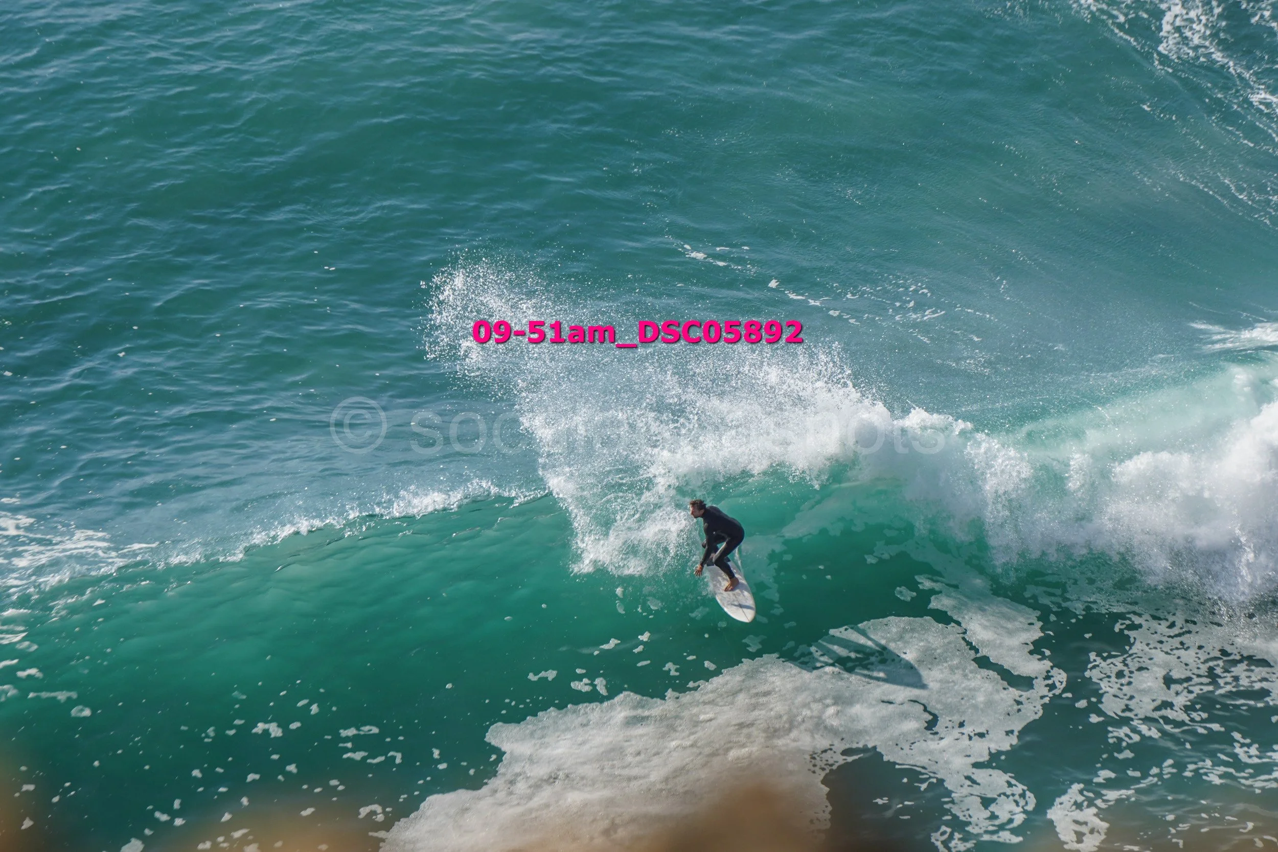 Surfer riding a wave in the ocean.