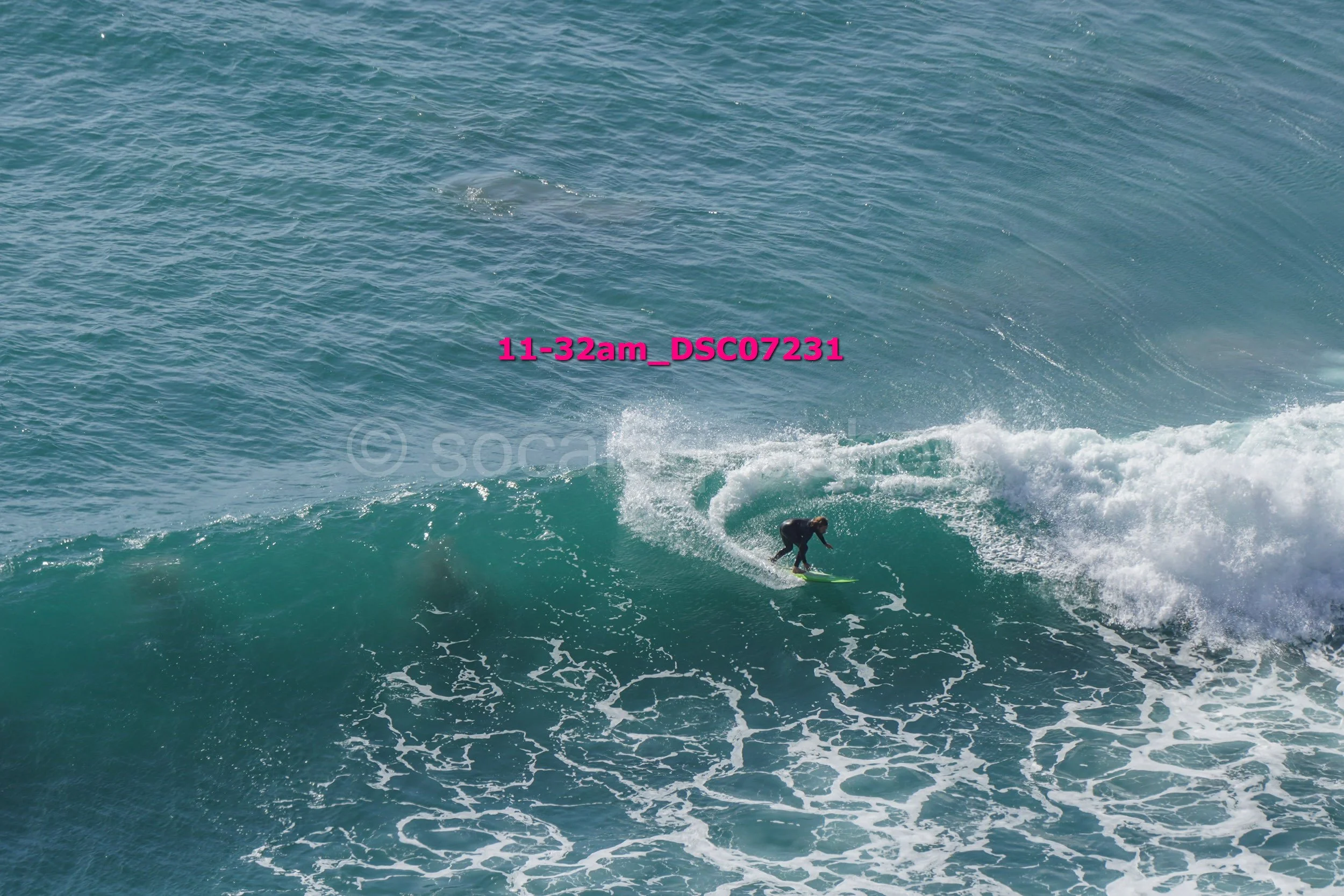 A person surfing on a wave in the ocean.