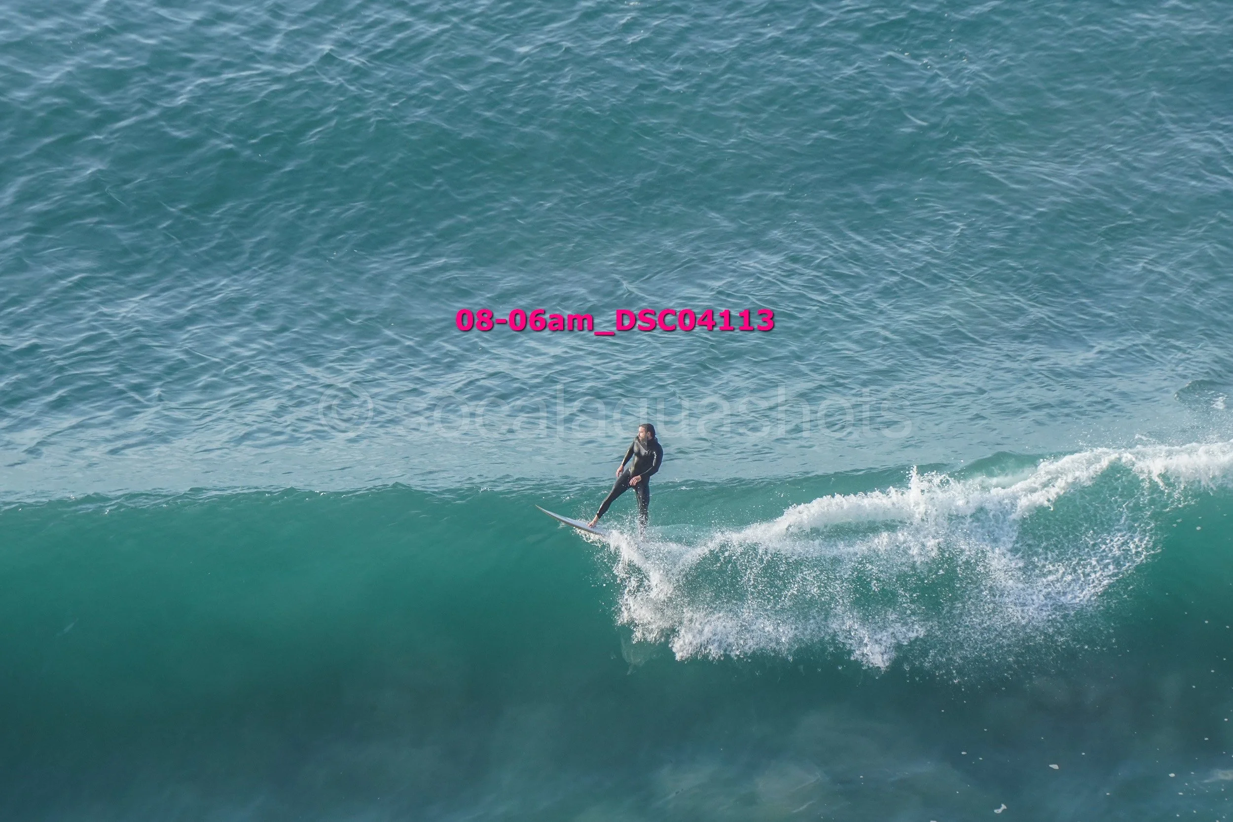 Person surfing on a wave in the ocean