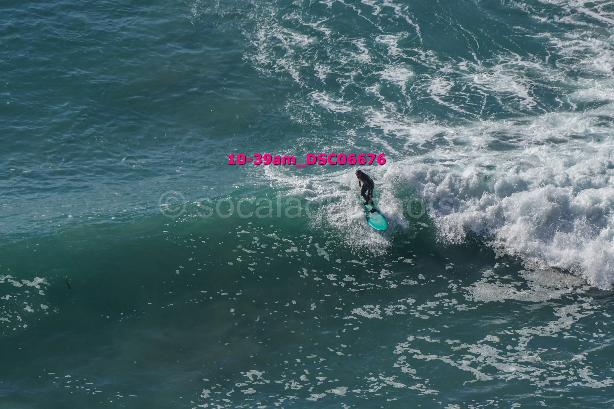 A person surfing on a wave in the ocean