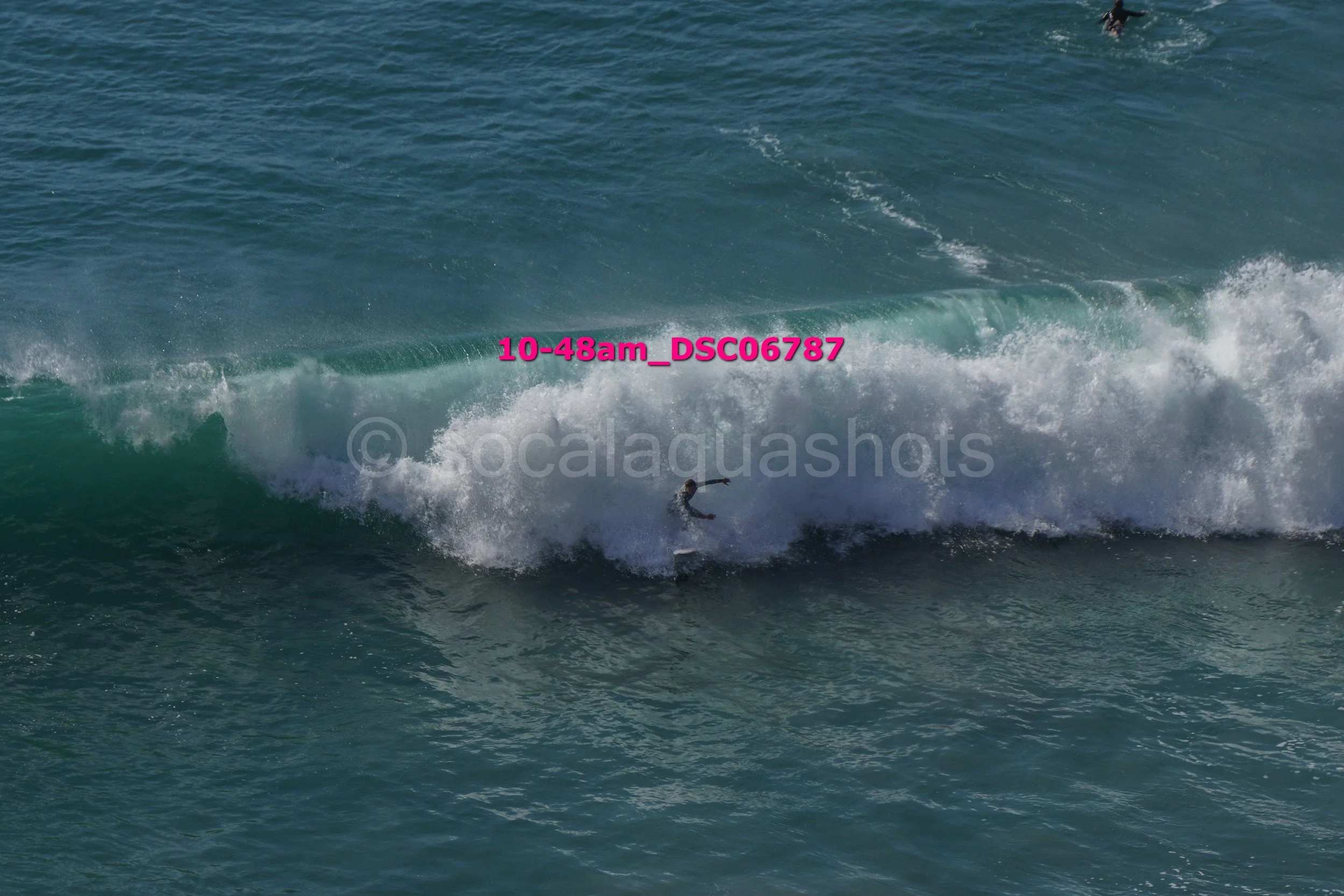 Surfer riding a wave in the ocean