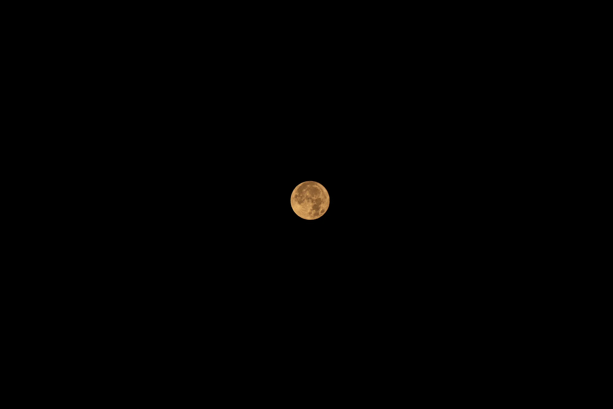 Full moon in a dark night sky.