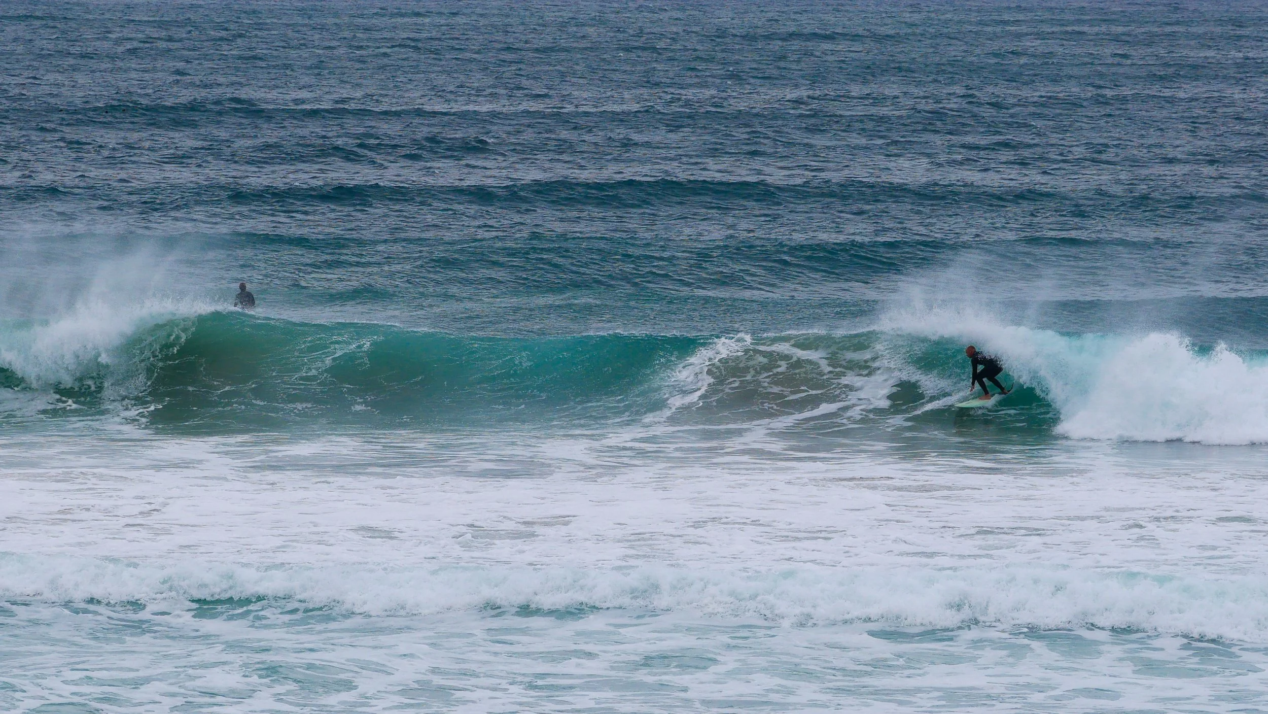 Surfer riding a wave in the ocean