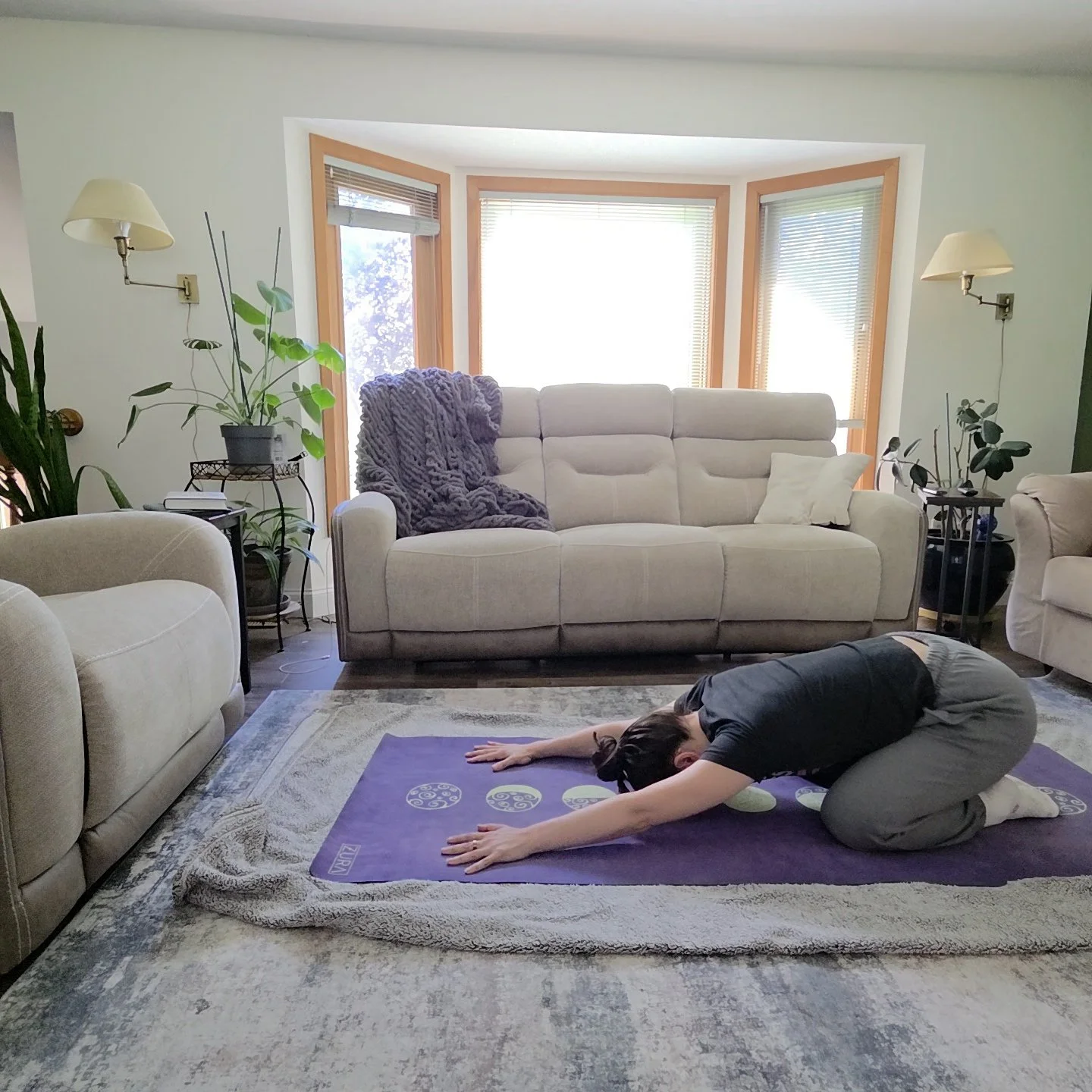 Jess Jimoh in childs pose beginner yoga