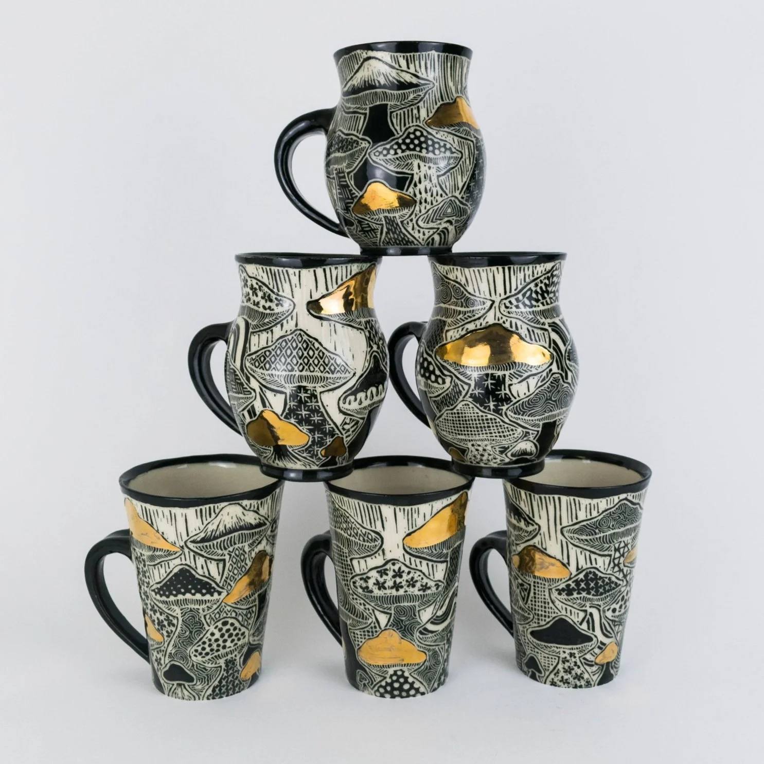 Mushroom Mugs 
Porcelain, black underglaze, 22k gold luster,
2024 