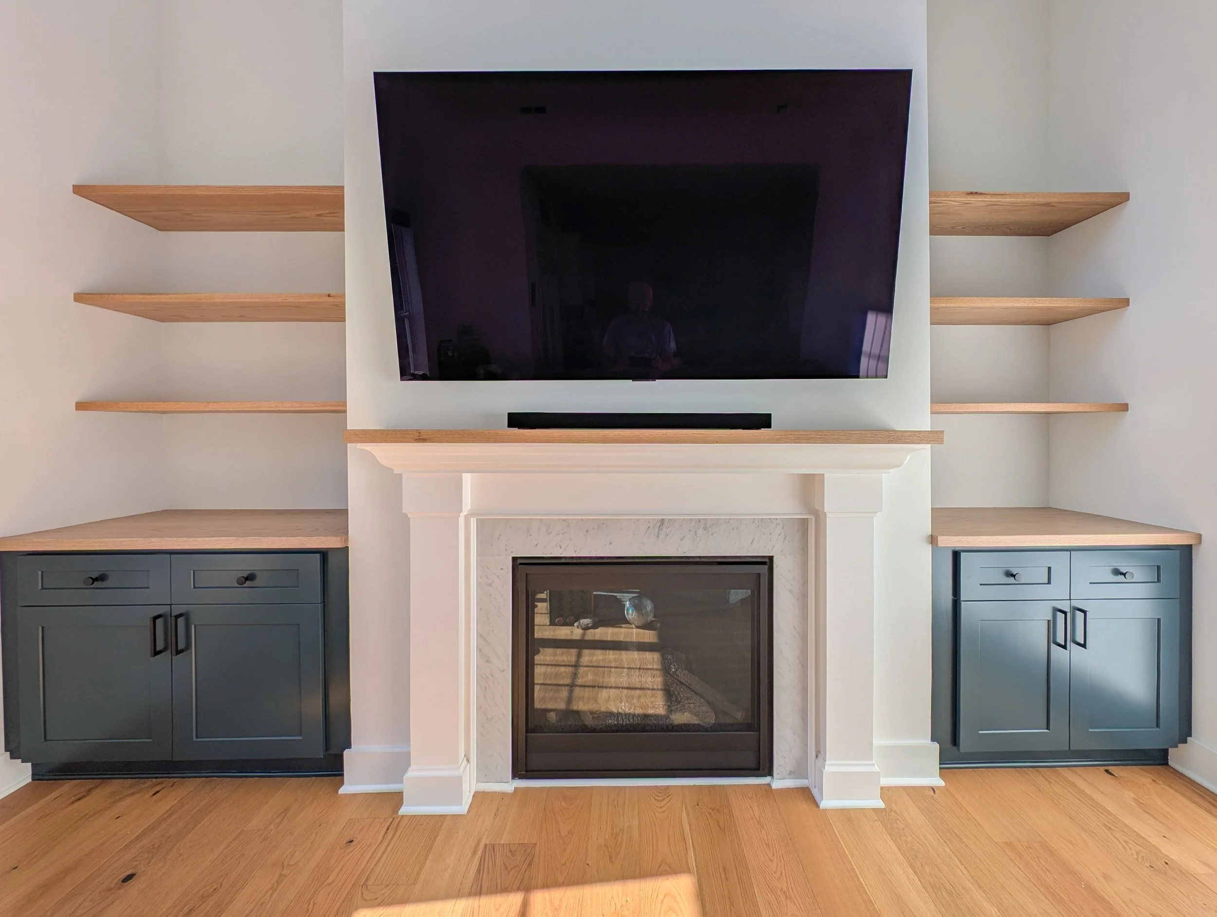 Custom Cabinets with white oak tops, shelving and mantle top