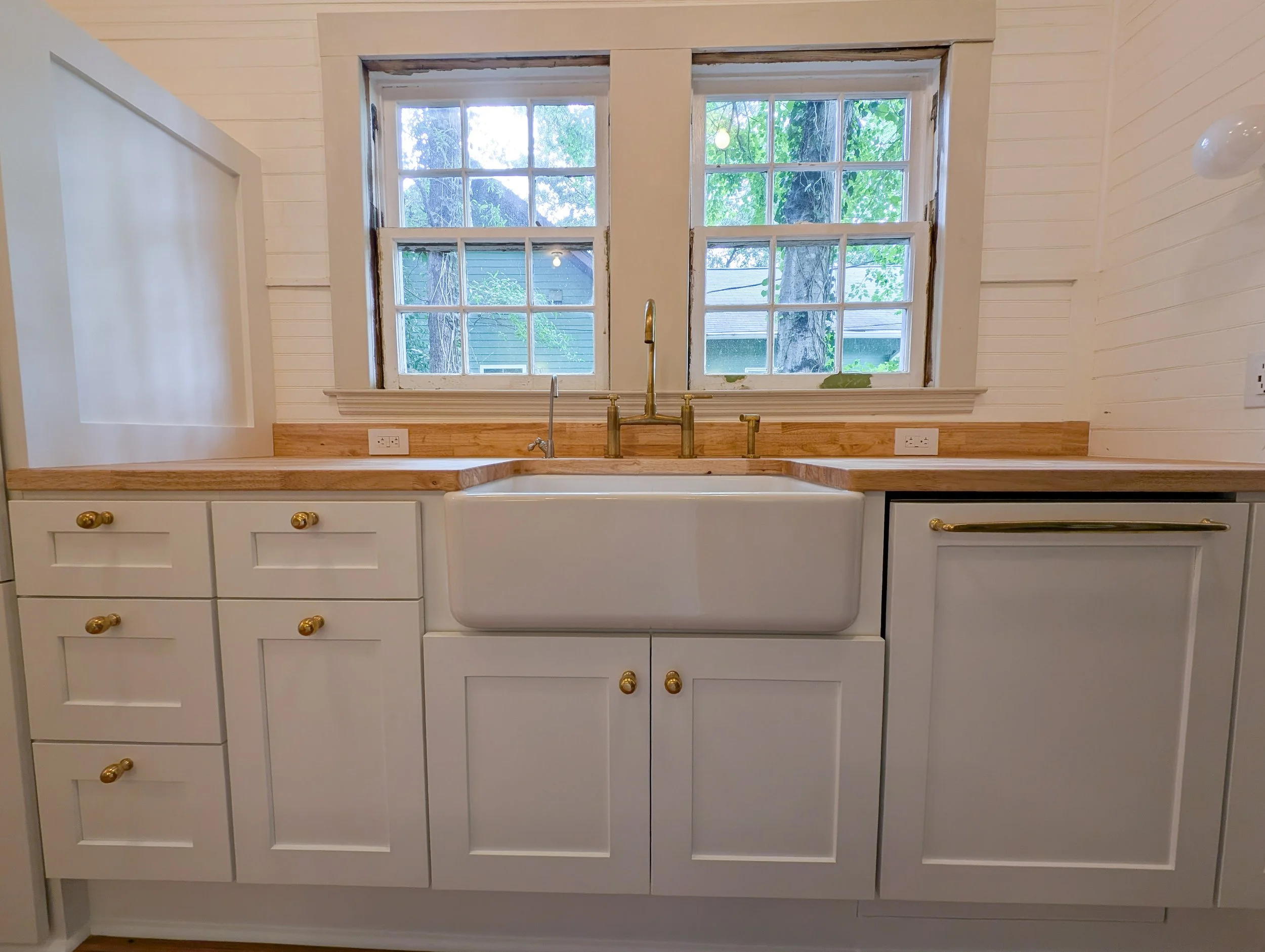 Front view of farmhouse sink In front of window