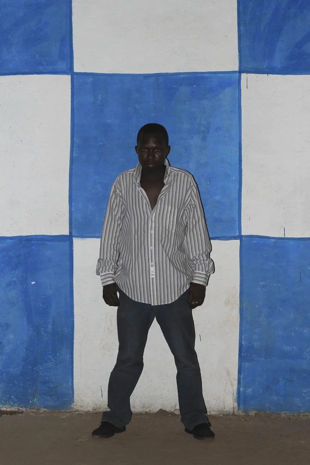 Striking Simplicity Against a Bold Checkered Wall
