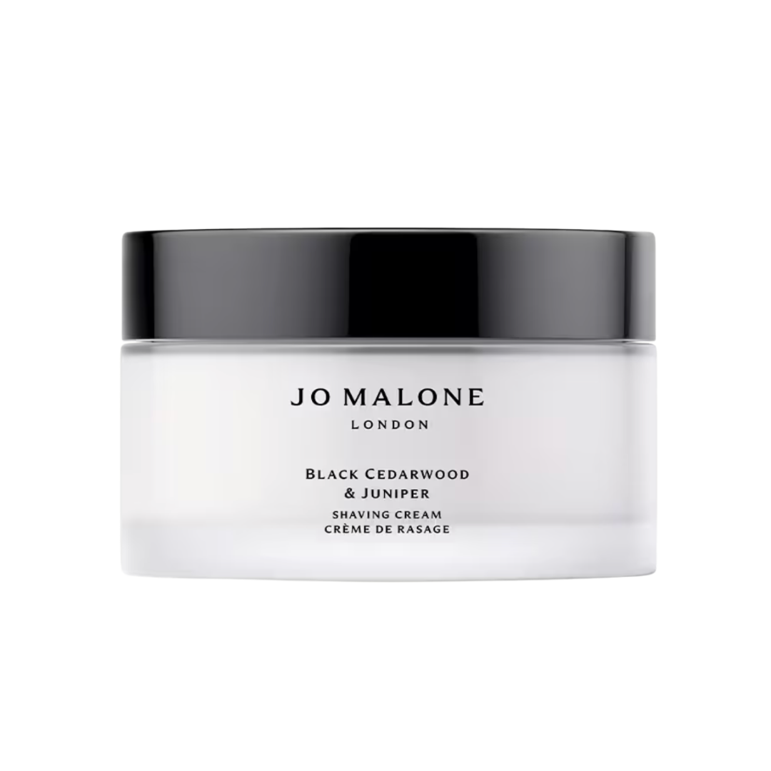 A wide white jar of Jo Malone London Shaving Cream with a sleek black screw-top lid.