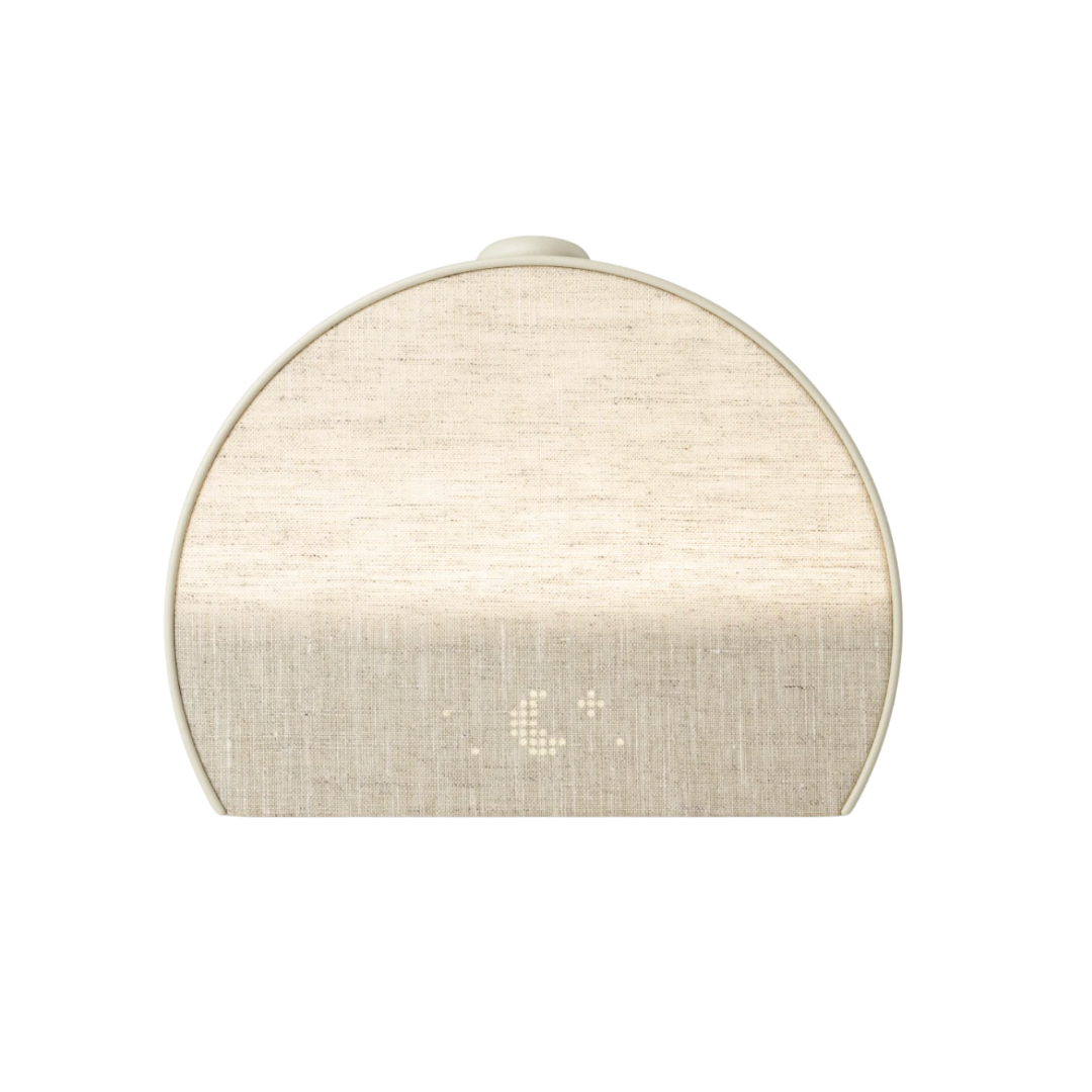 A modern, arched bedside sleep assistant in a soft sand-colored fabric with a digital time display.