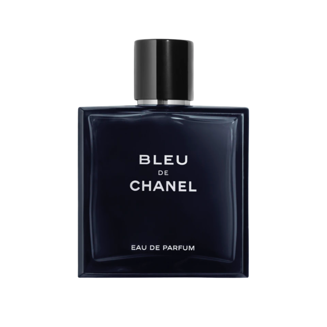 A square, deep navy blue glass Chanel bottle with bold white lettering and a magnetic black cap.