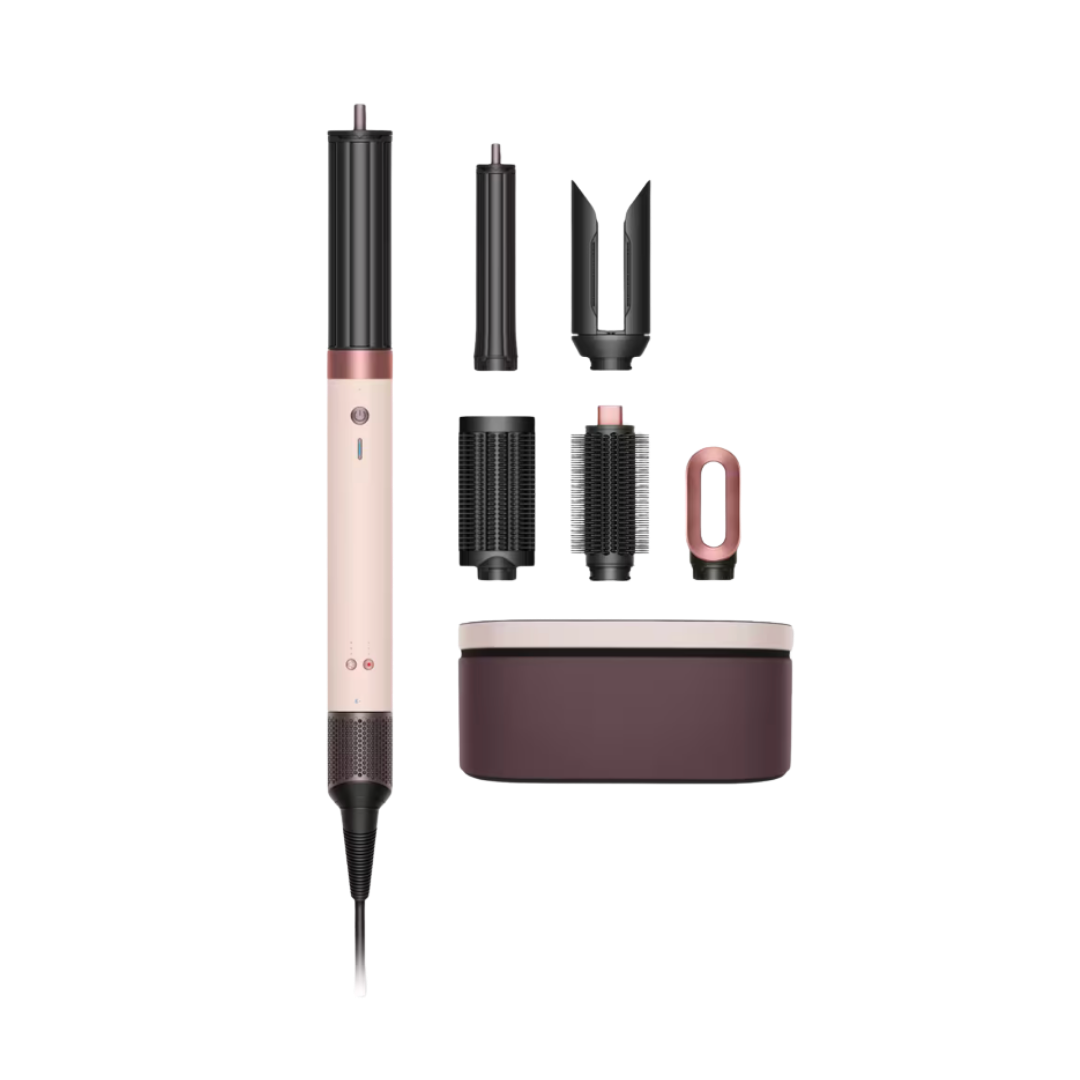 A Dyson Airwrap multi-styler in a limited edition "Strawberry Bronze" and black finish, shown with several curling and smoothing attachments.