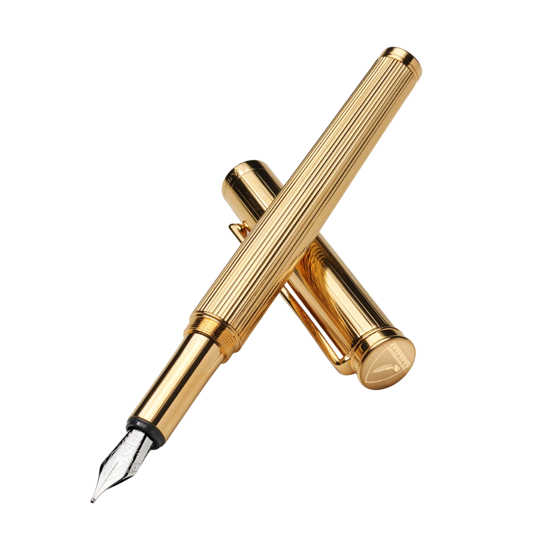 A luxury gold fountain pen with a textured, ribbed barrel, shown with its cap leaning against it.
