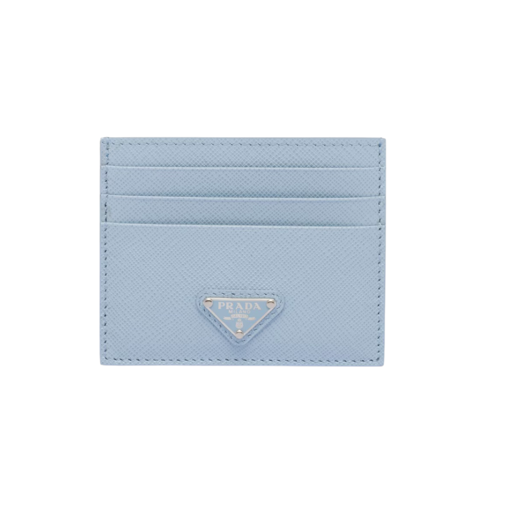 A light blue sky-toned Prada Saffiano leather card case with a matching triangular logo.