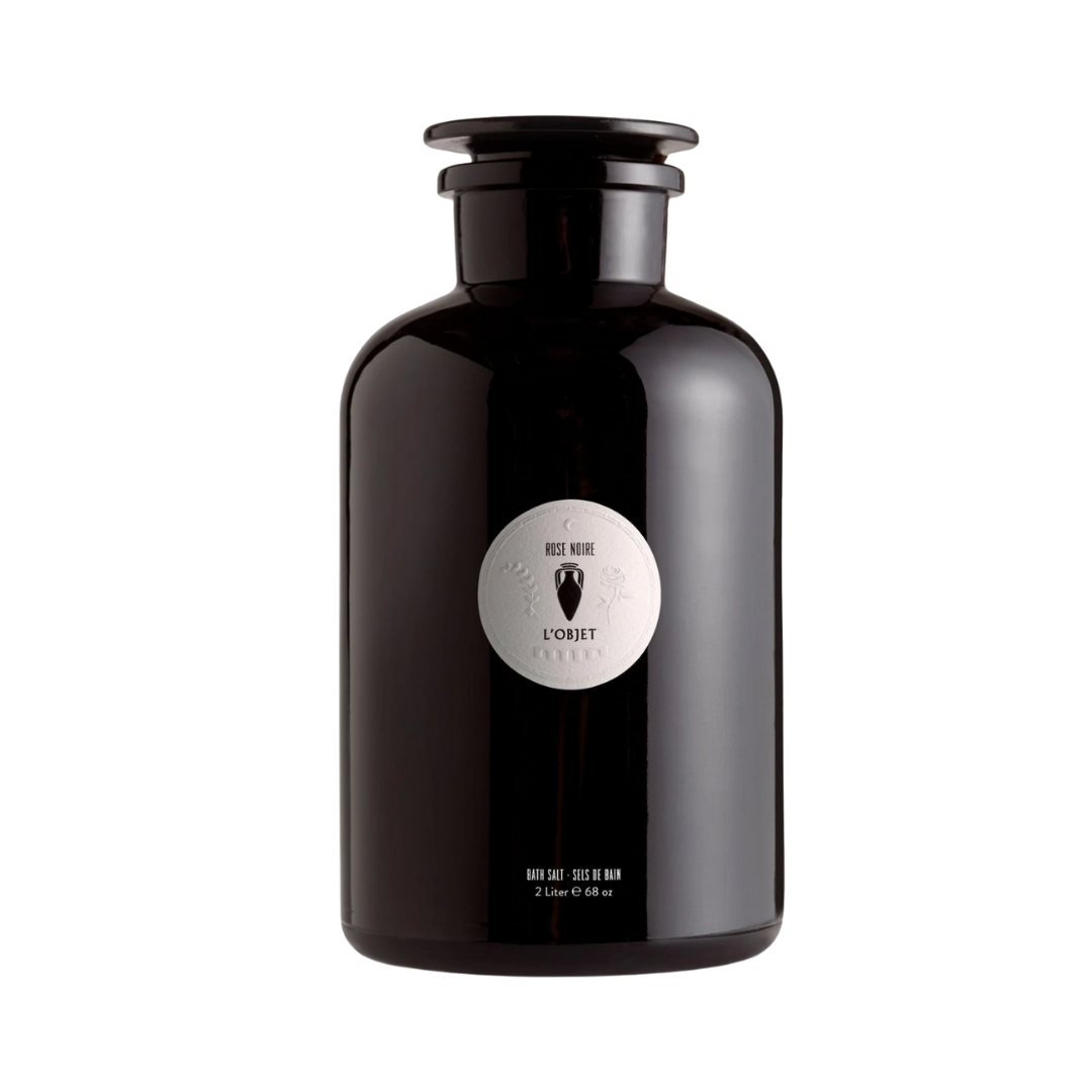 A sleek, oversized black apothecary-style bottle with a white "Rose Noire" label.