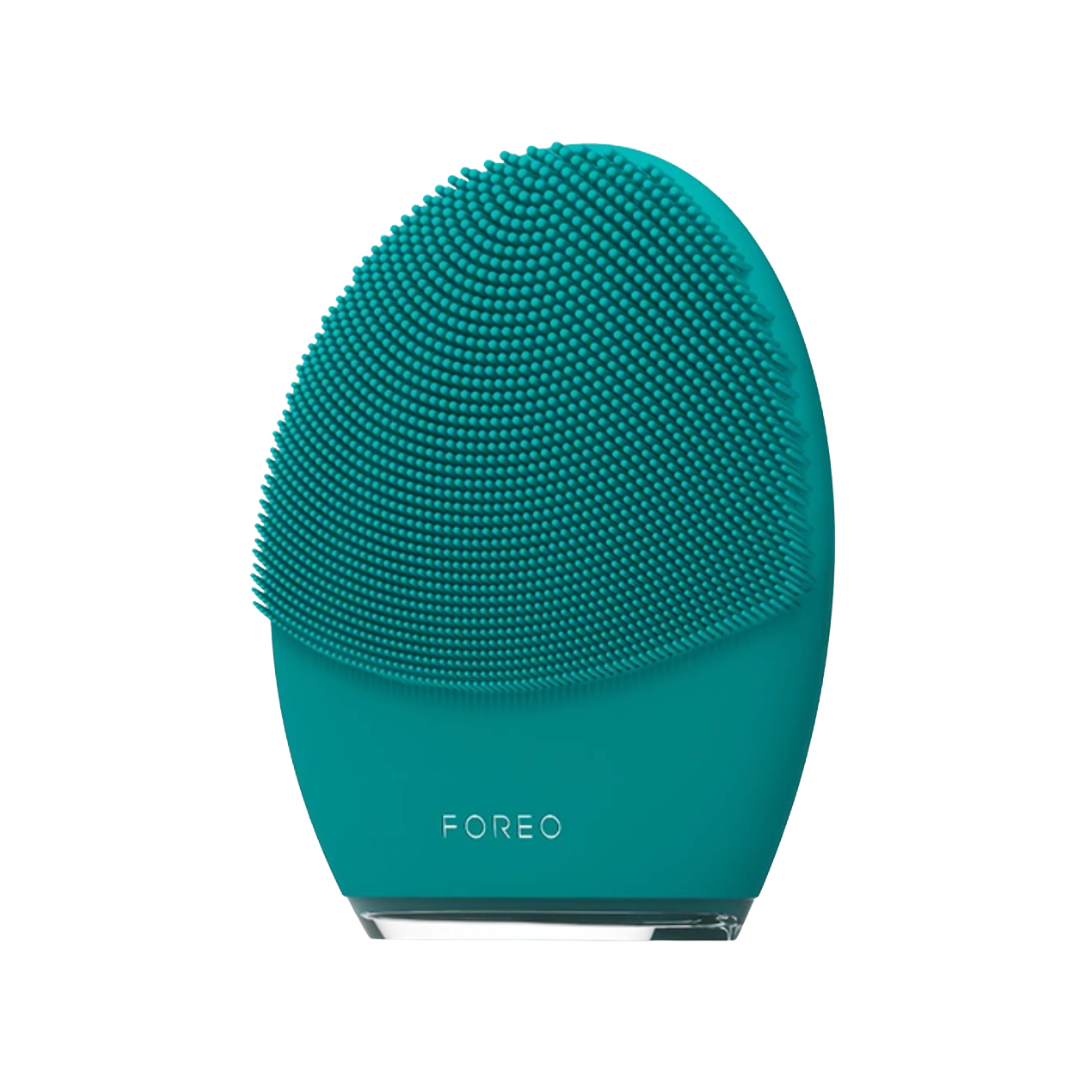 A teal-colored silicone Foreo Luna 4 Men facial cleansing device with a textured bristle surface.