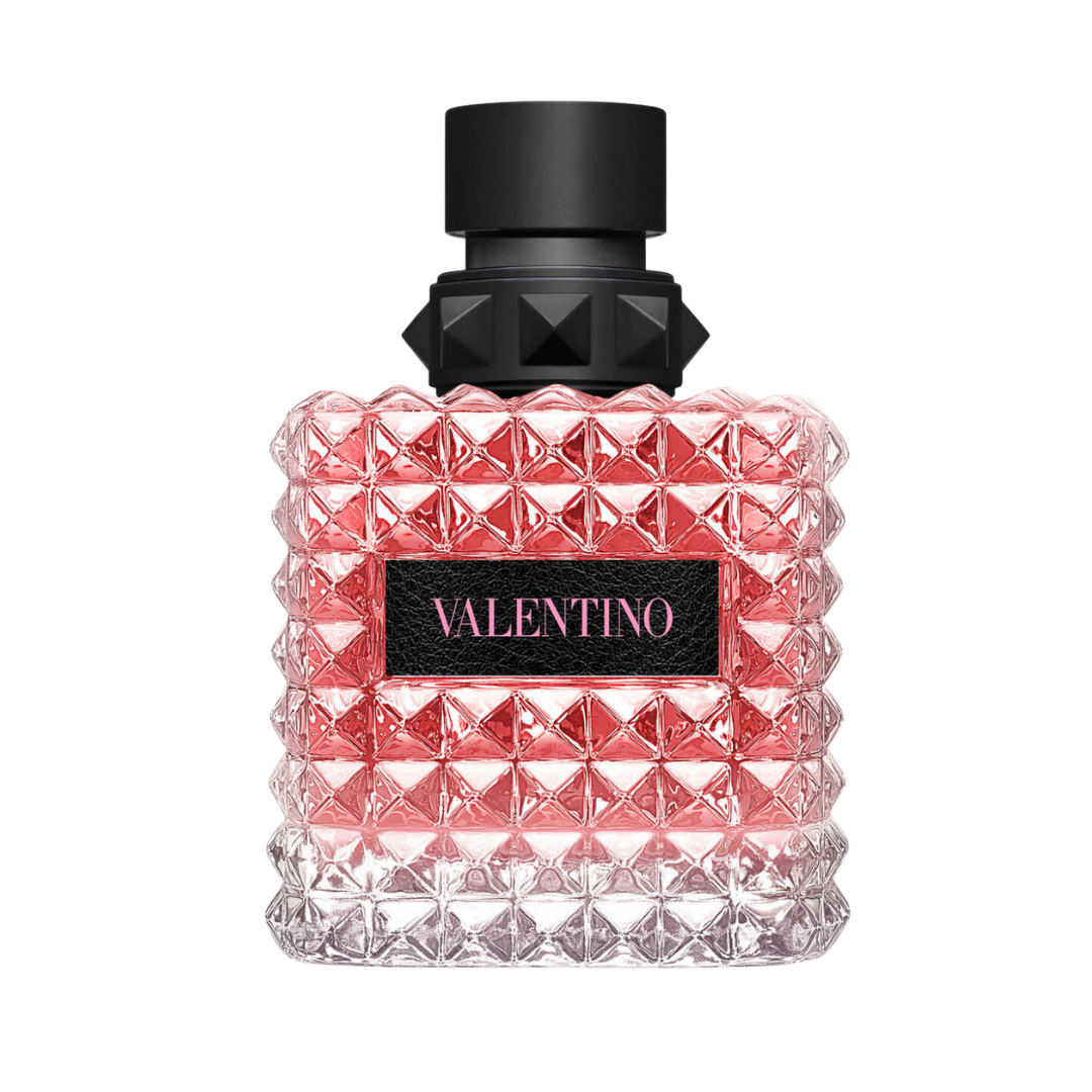 A Valentino Born in Roma perfume bottle featuring the iconic pink liquid and all-over raised pyramid 'rockstud' glass texture.
