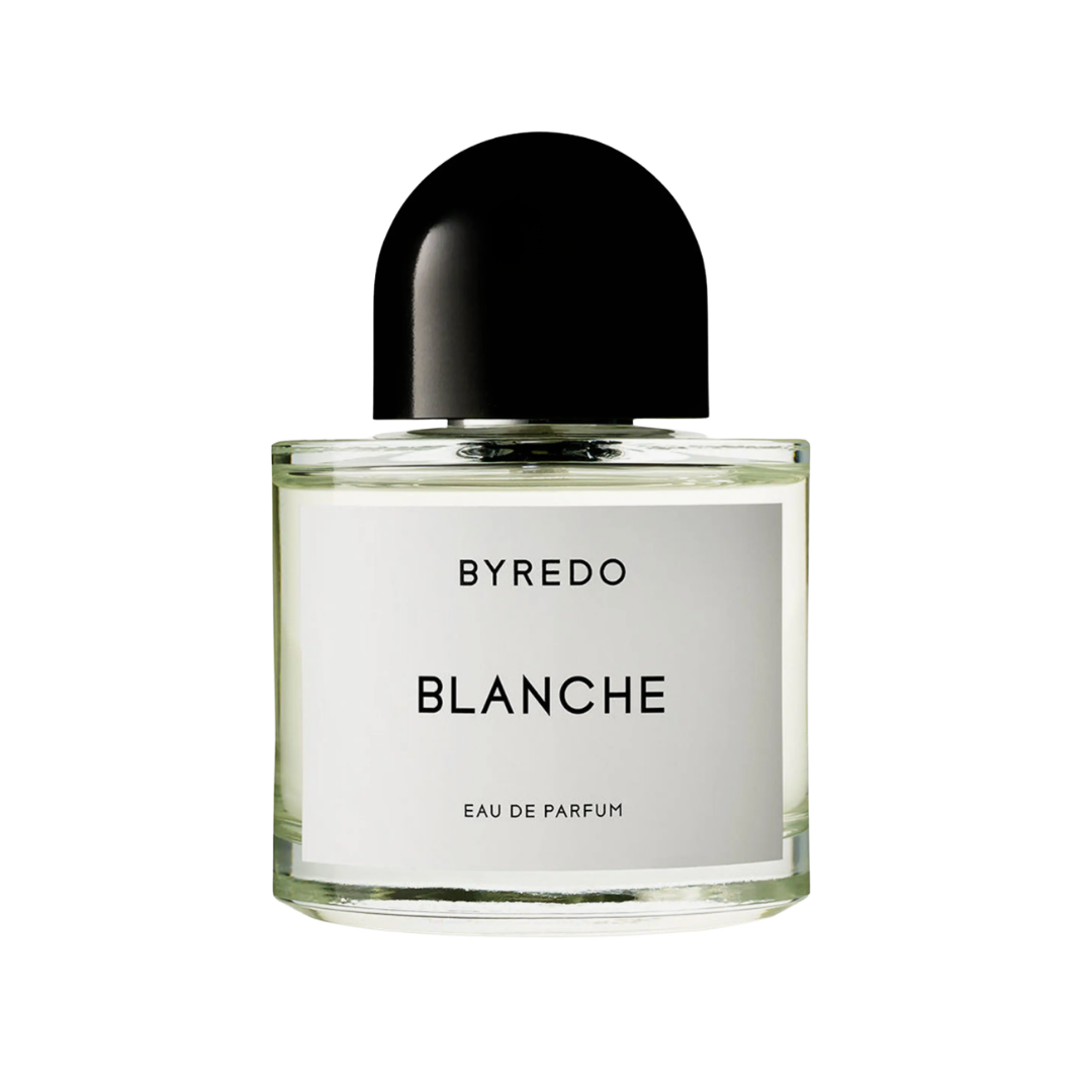 A clear glass Byredo Blanche perfume bottle with a signature rounded black cap and white label.