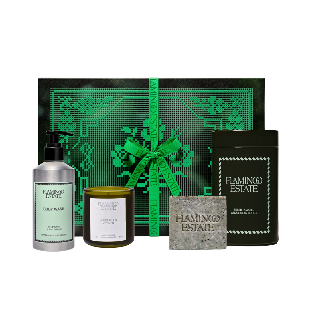 Flamingo Estate The Awake Morning Kit featuring botanical body wash, candle, olive oil soap, and tea in green gift box