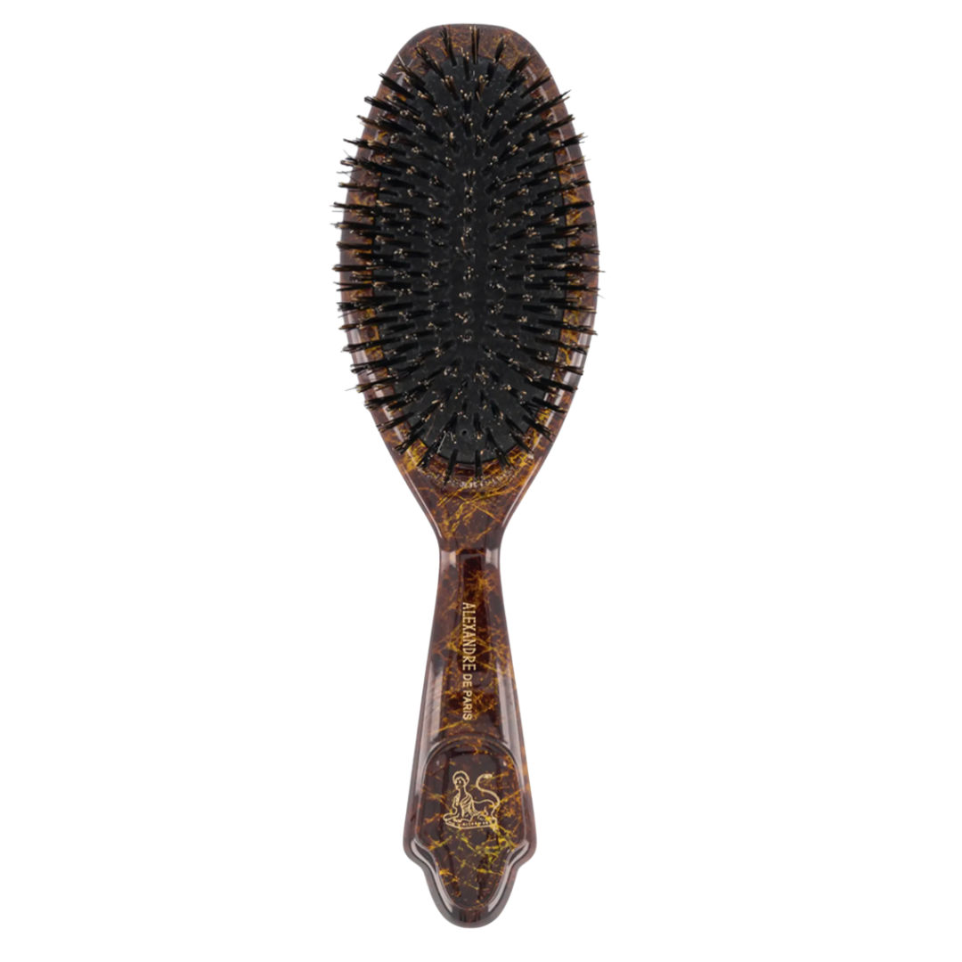 A luxury Boar Bristle hairbrush with a dark tortoiseshell handle and gold branding.